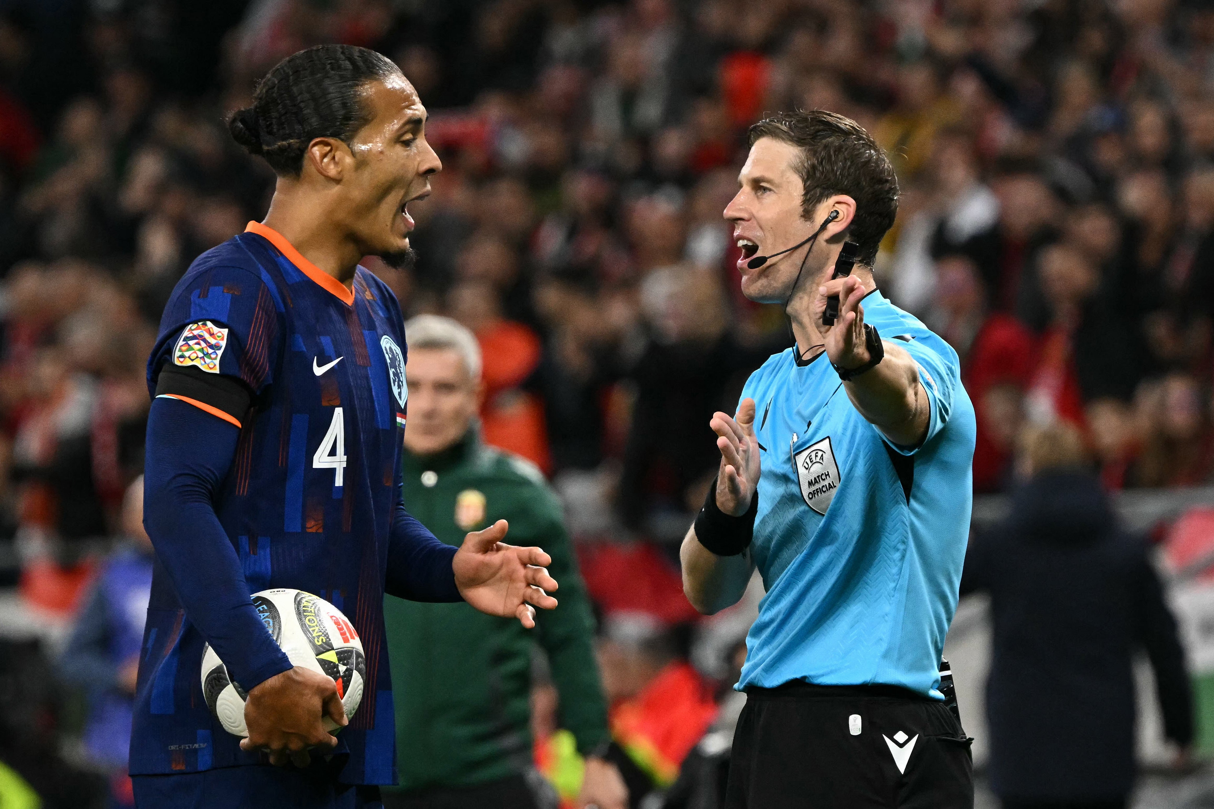 Virgil van Dijk remonstrates with Swiss referee Lukas Faehndrich