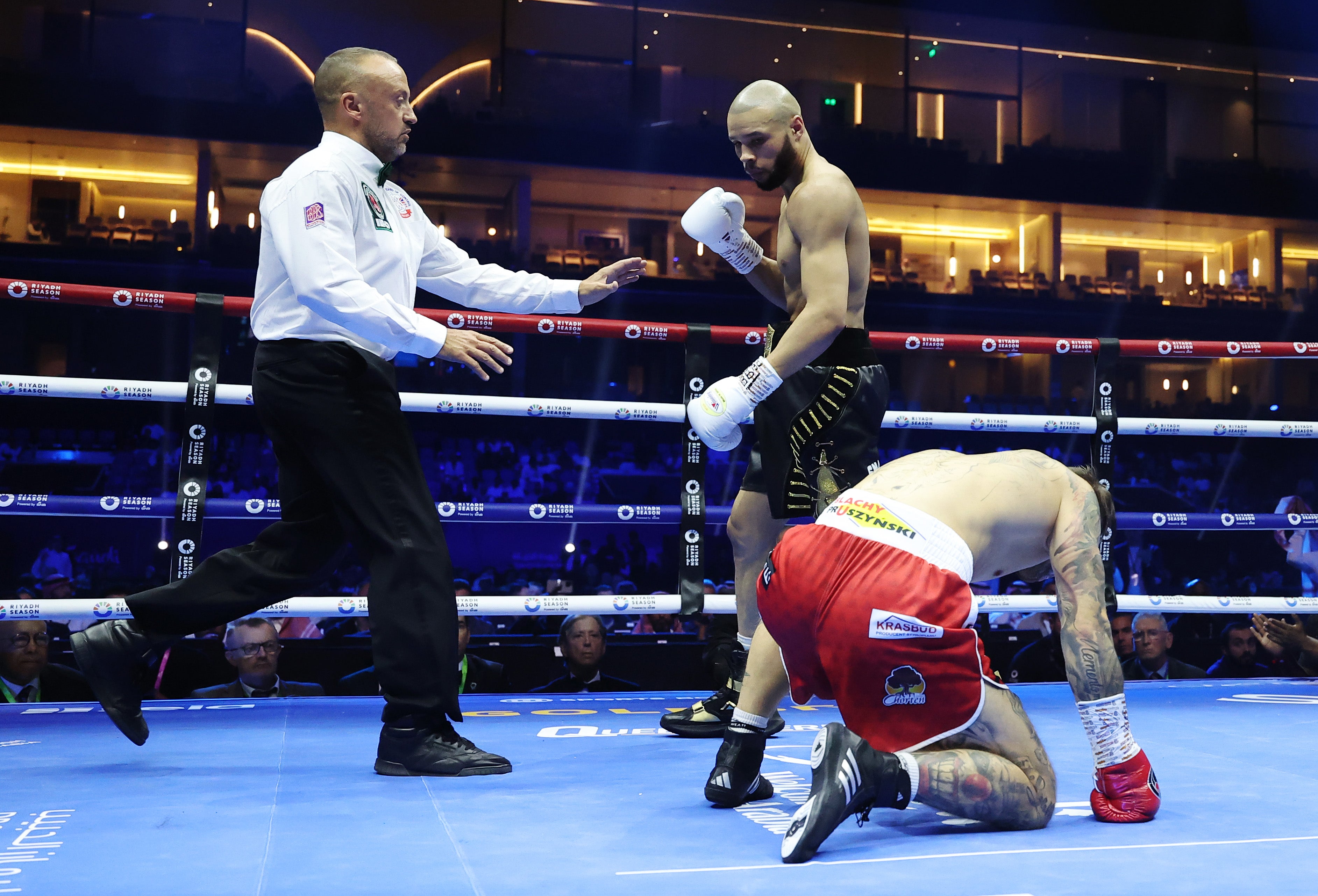 Chris Eubank Jr (centre) after dropping Kamil Szeremeta