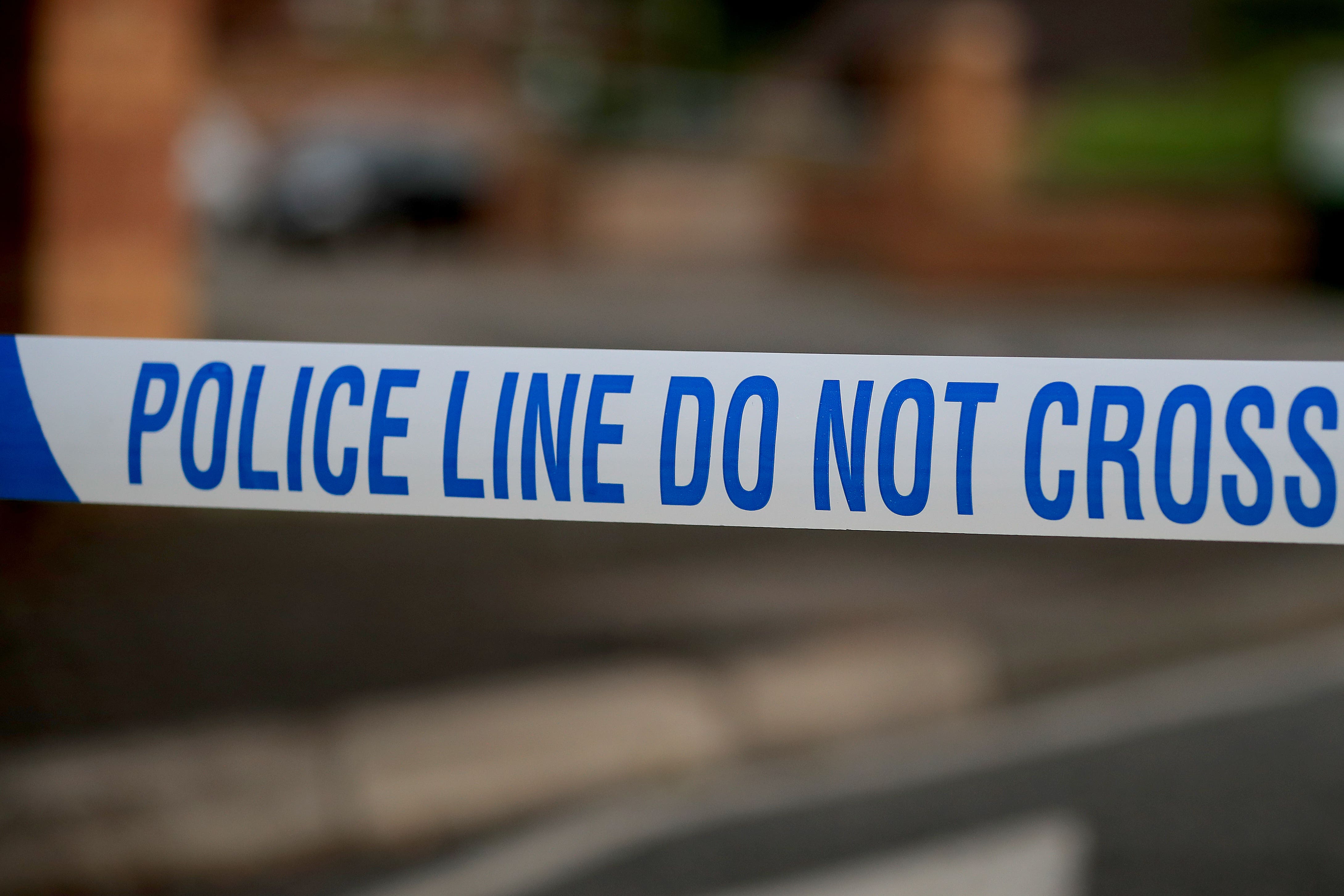 A generic stock photo of police tape at a crime scene (Peter Byrne/PA)