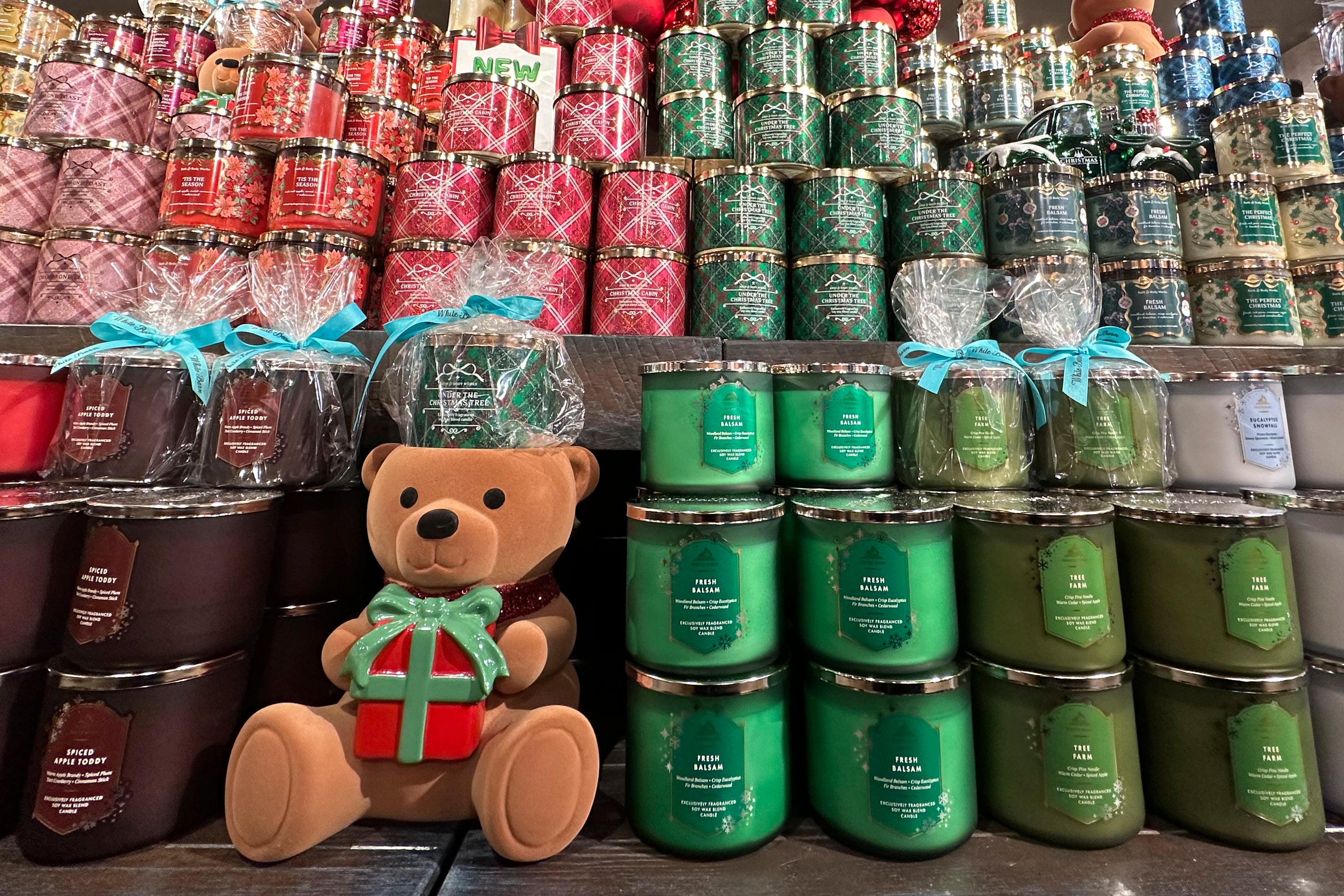 An arrangement of holiday themed scented candles is shown at a Bath and Body Works store on Wednesday, Oct. 9, 2024, in New York. (AP Photo/Peter Morgan)