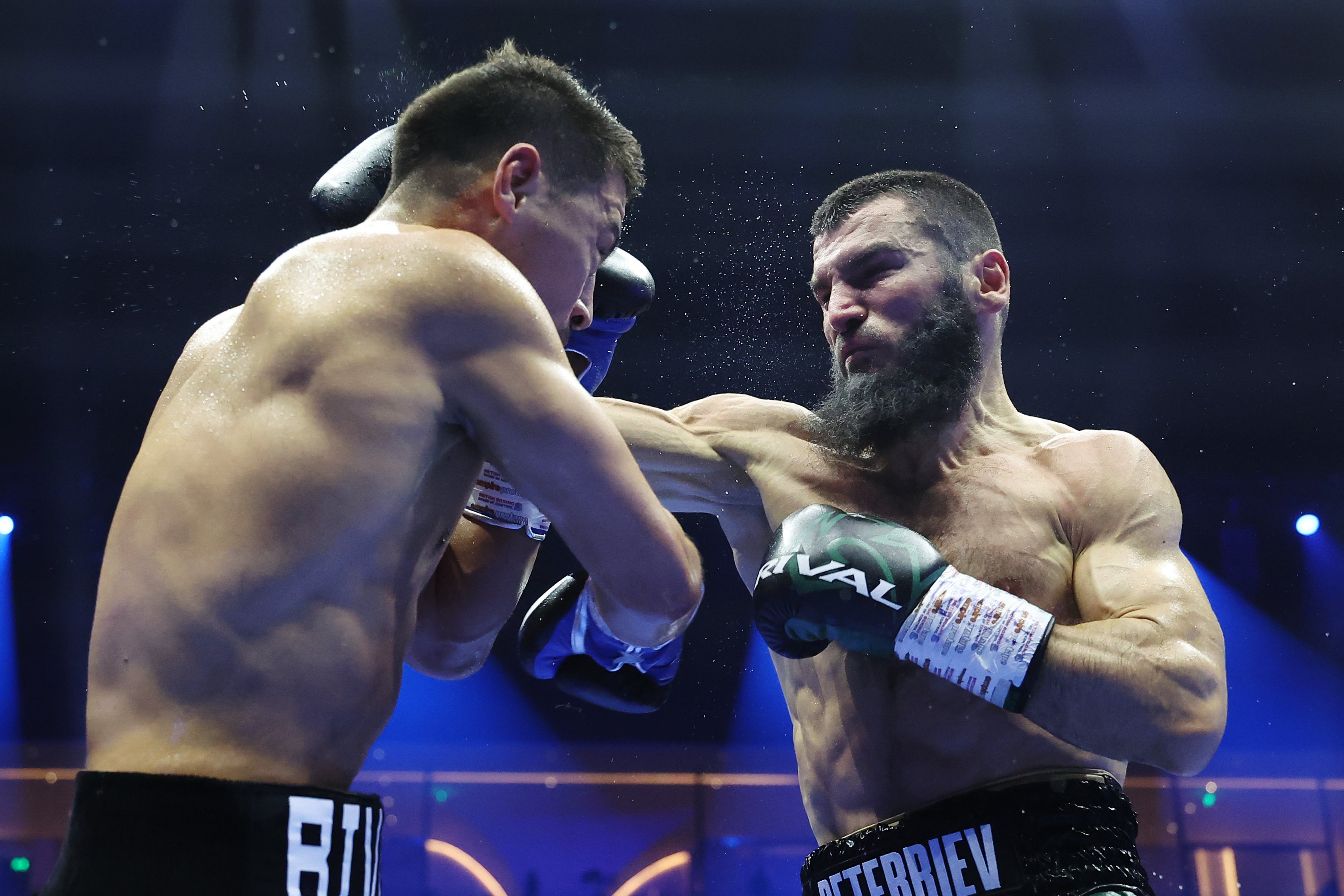 Bivol (left) shone against a similarly impressive Beterbiev but was able to convince the judges