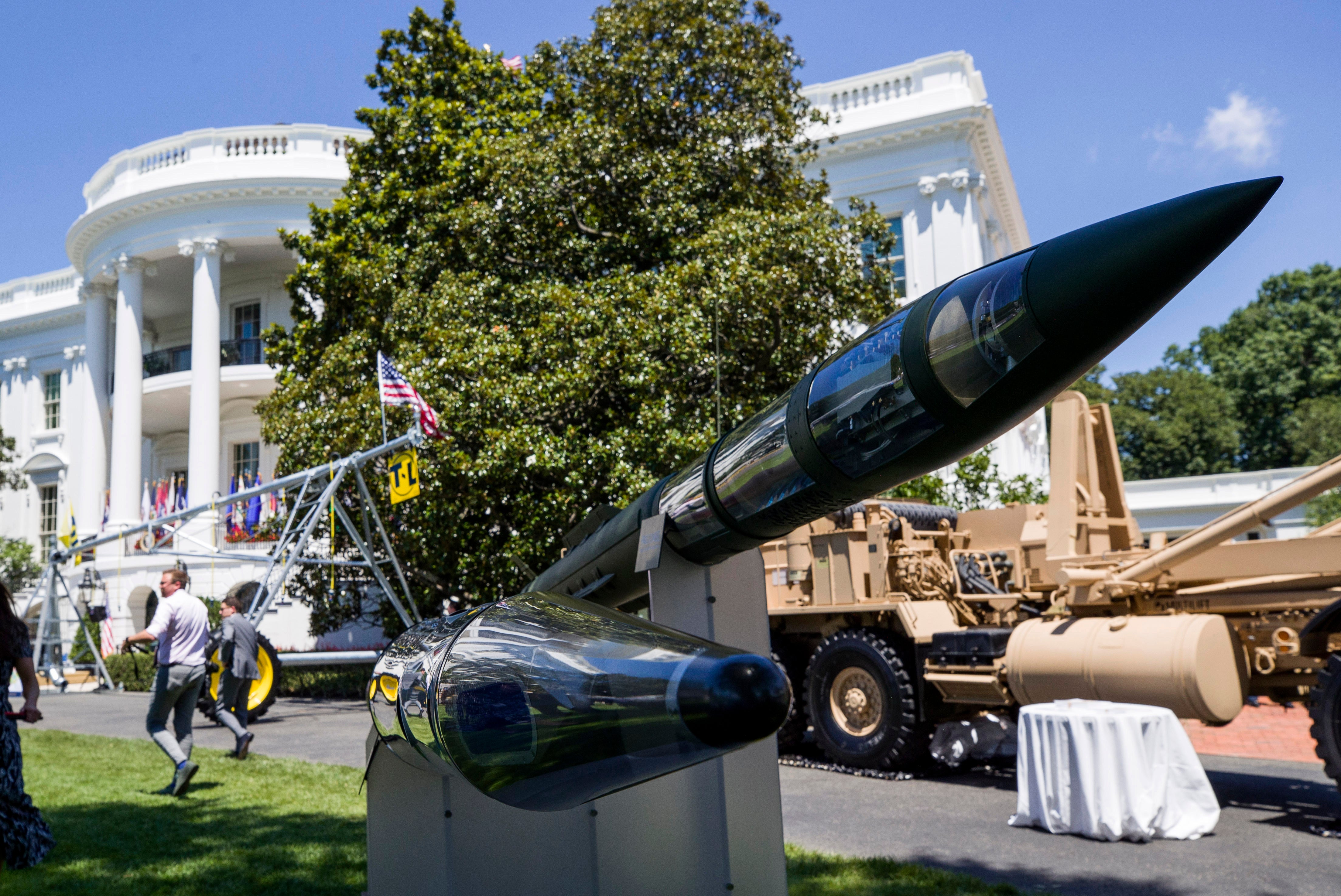 A Terminal High Altitude Area Defense (THAAD) anti-ballistic missile system is displayed