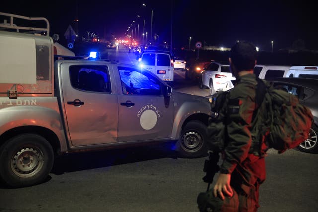 <p>Emergency services personnel attend the scene of a drone strike on Sunday in Binyamina, Israel </p>