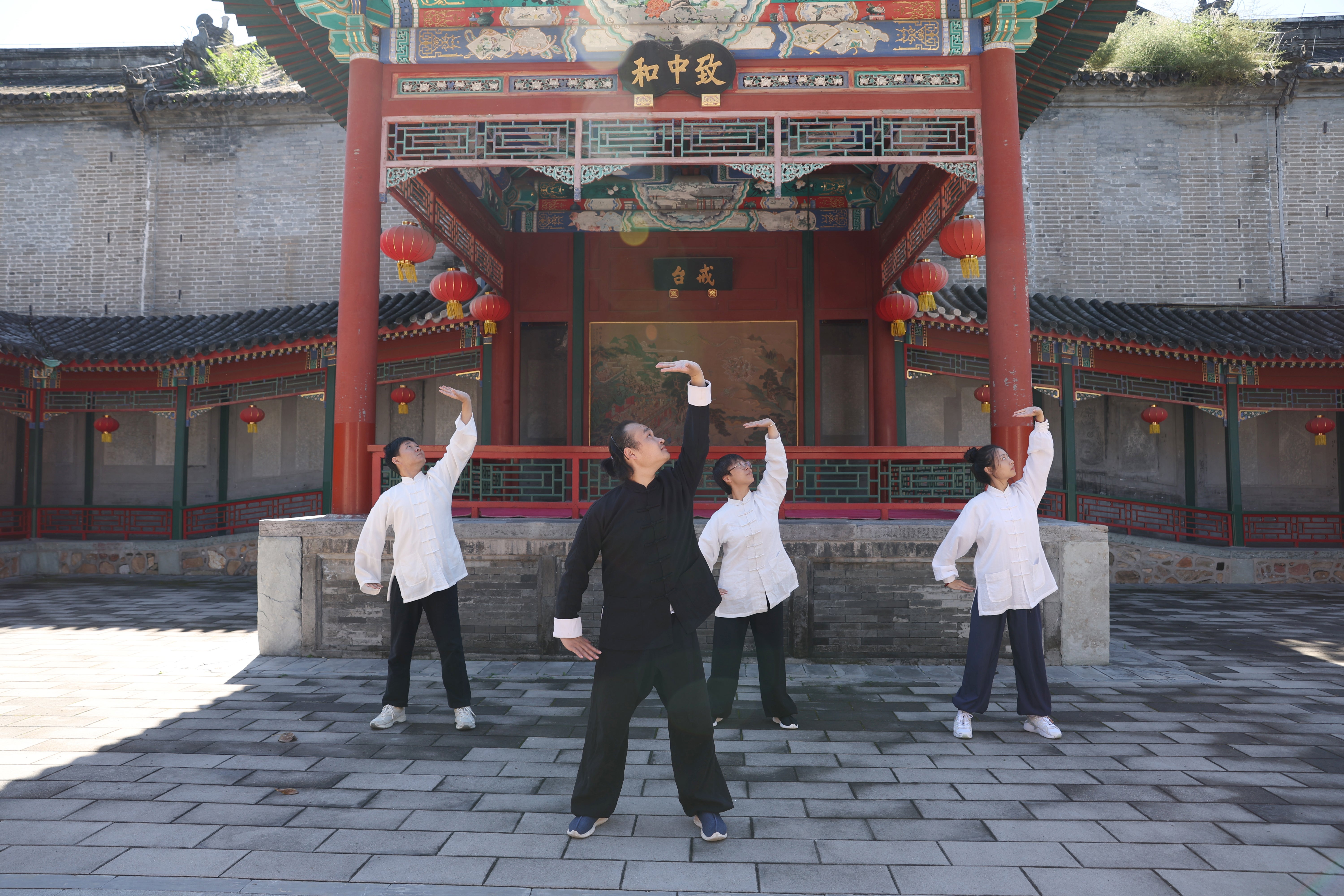 Deng Jiayi (front) teaches baduanjin at Baiyun Temple in Beijing