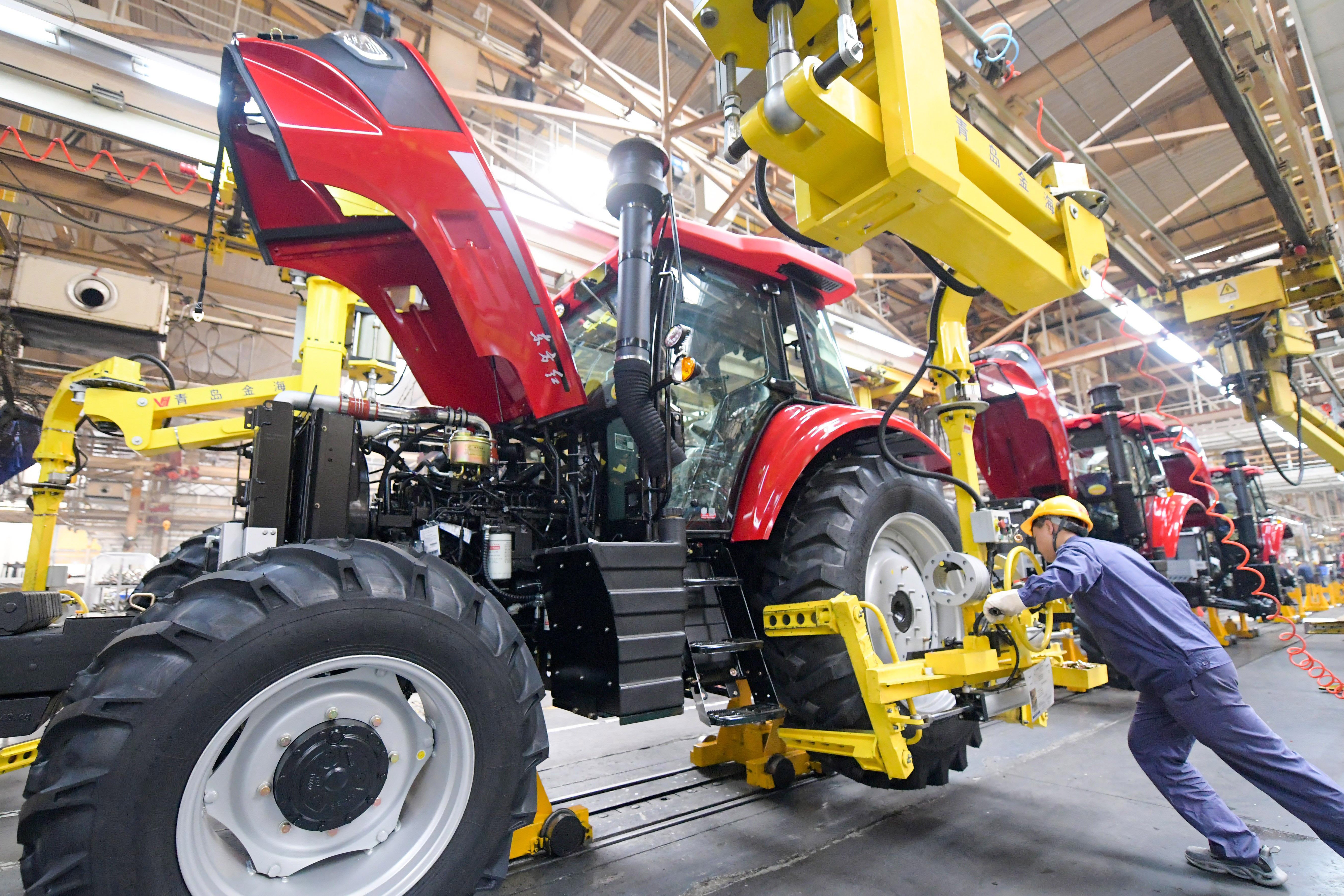 An employee works on a heavy machinery production line in Luoyang, Henan province