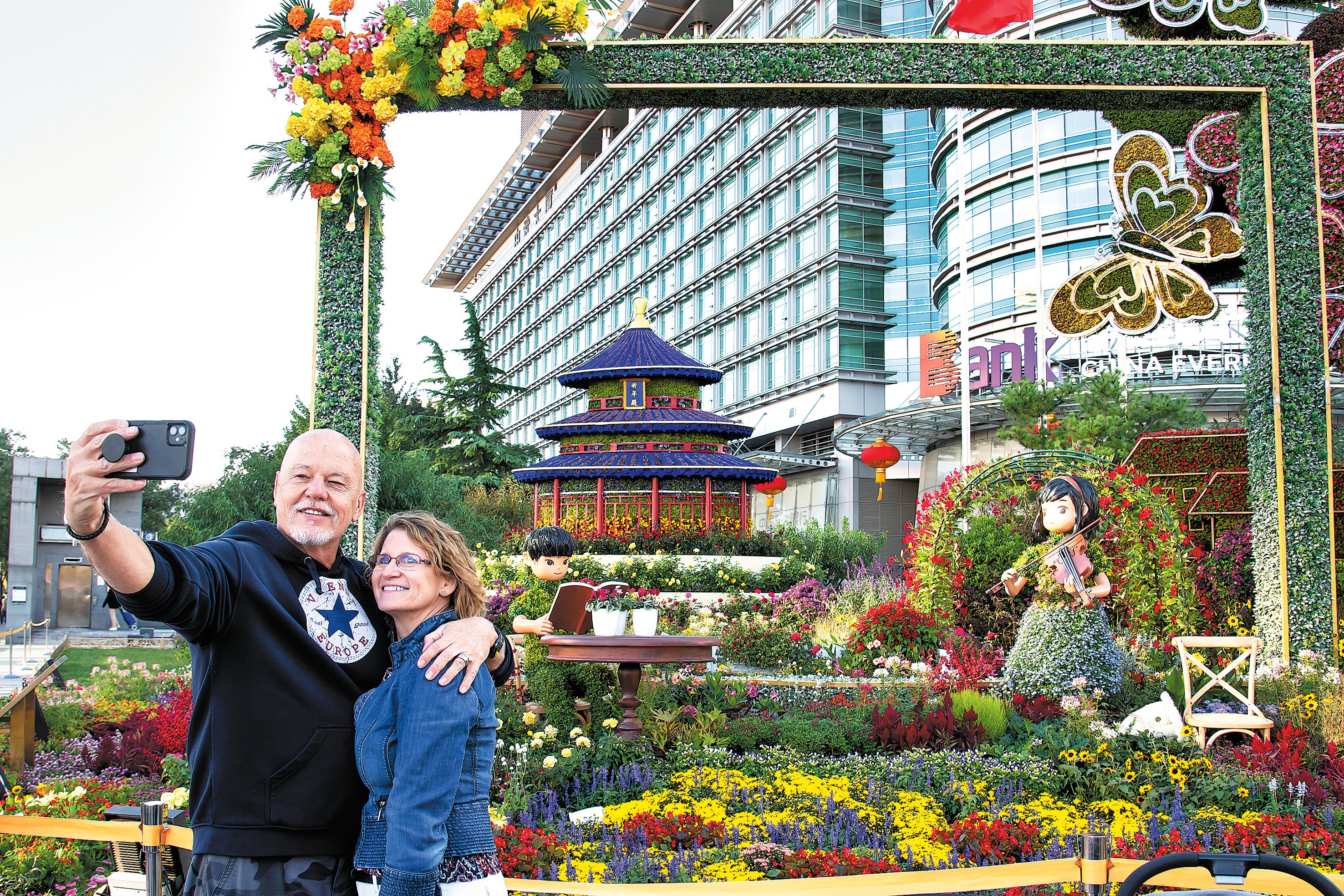 A foreign couple take a selfie at a scenic spot in Beijing on 1 October