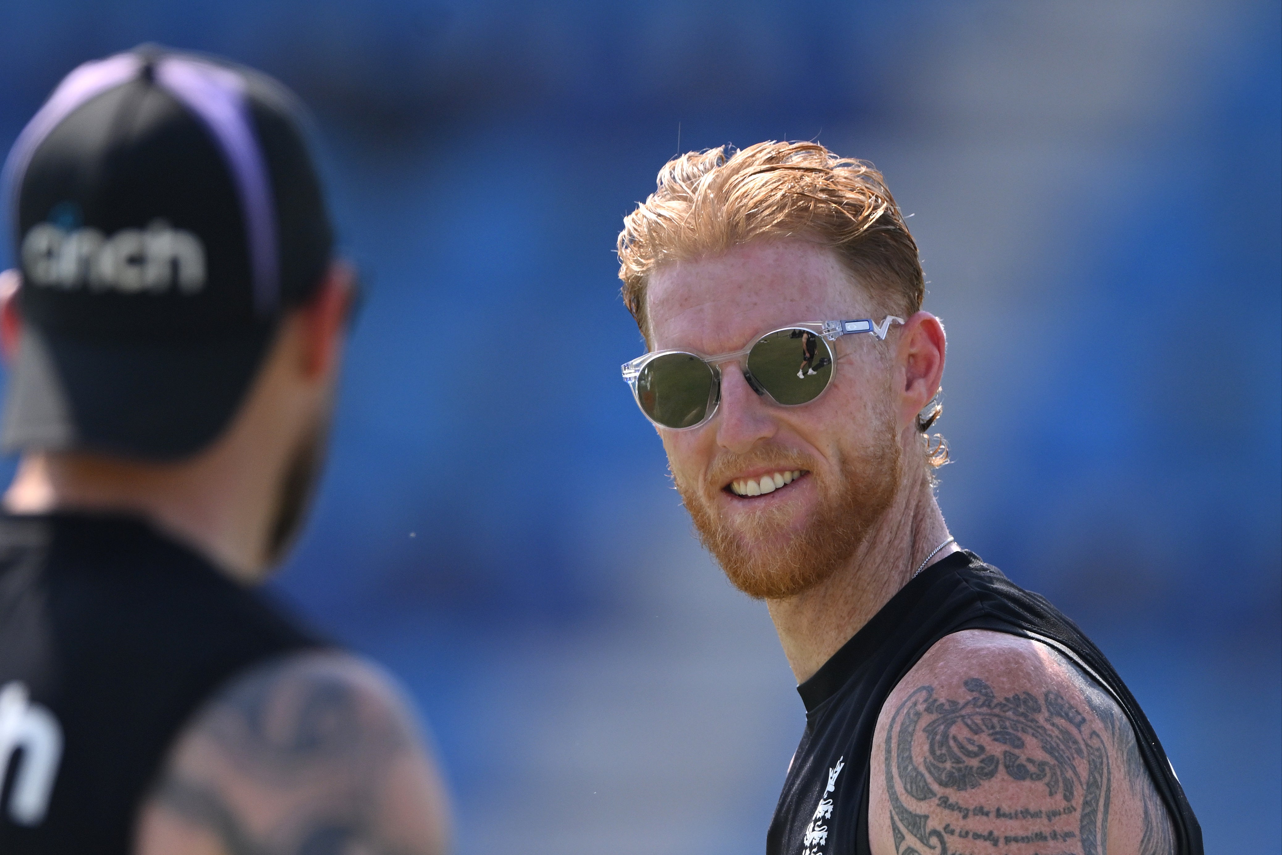 England captain Ben Stokes smiles as he talks to coach Brendon McCullum during nets