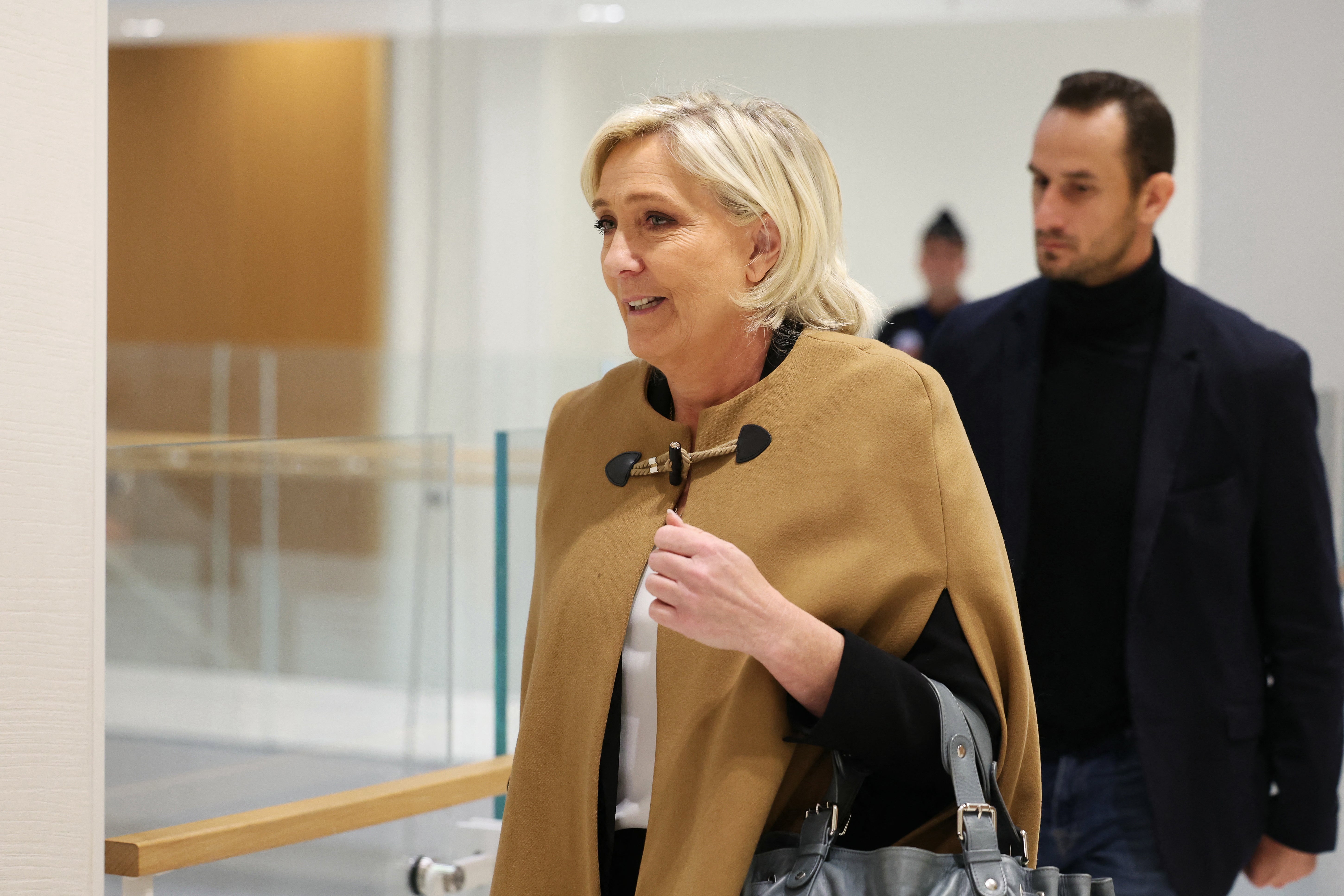 Le Pen arrives at a Paris court house for the trial