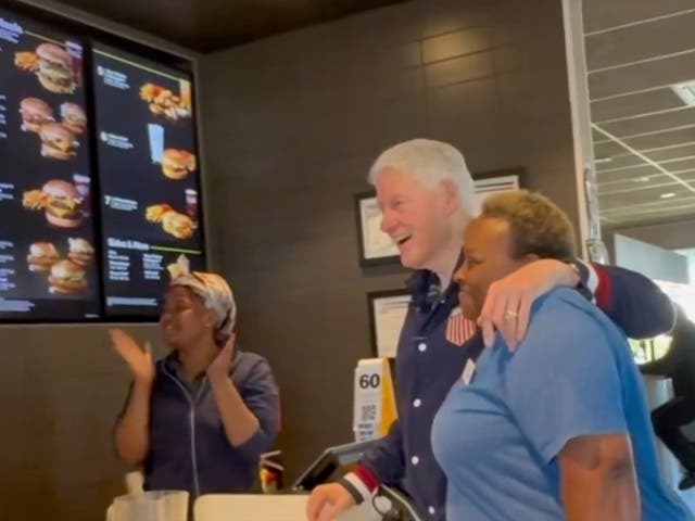 <p>Former President Bill Clinton poses with a worker during a breakfast stop at a McDonald’s in Georgia while he was campaigning for Vice President Kamala Harris</p>