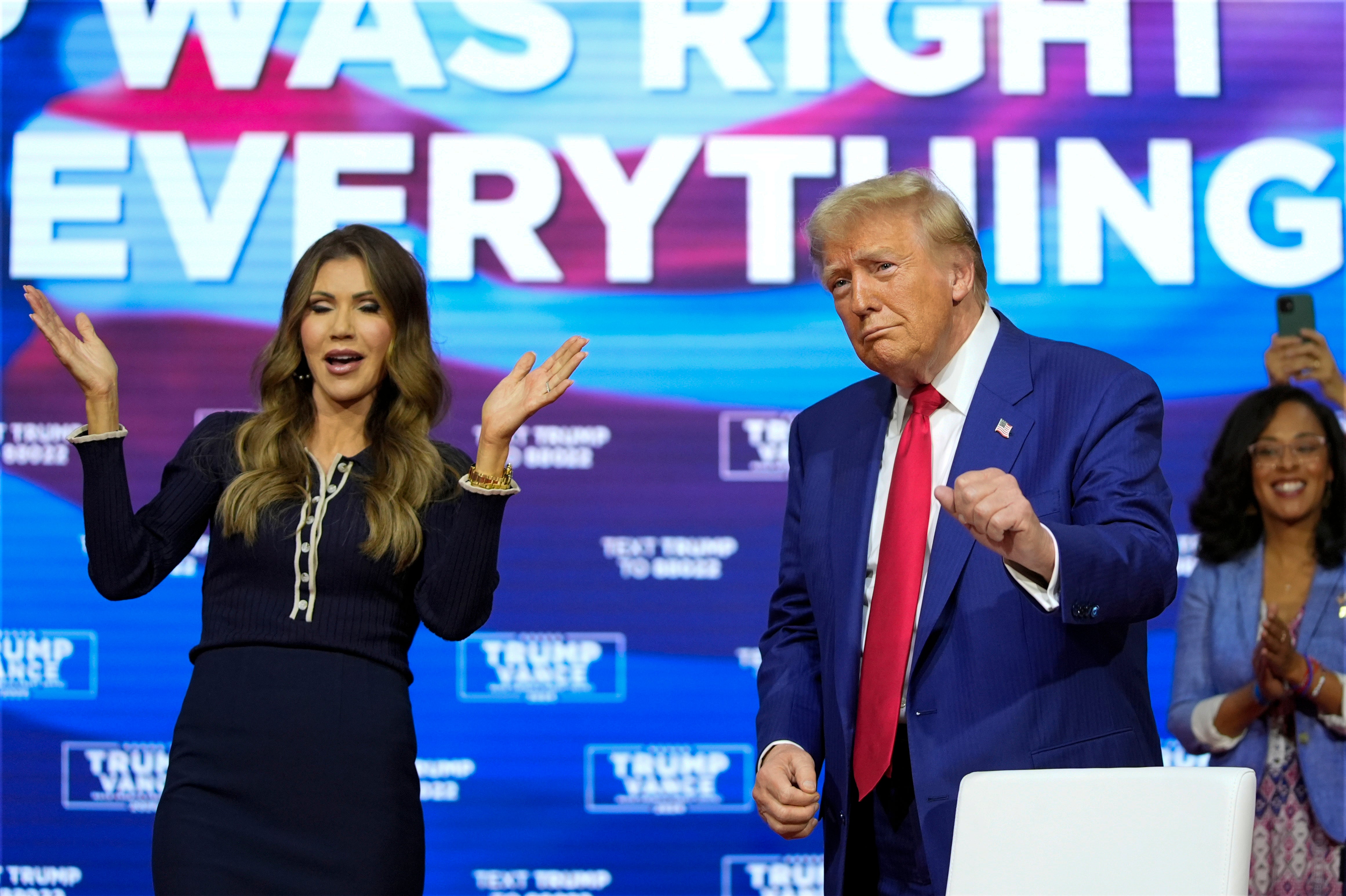 South Dakota Gov. Kristi Noem dances with Republican presidential nominee Donald Trump during a town hall. Most of the event was Trump standing around after a Q&A was derailed by people falling ill