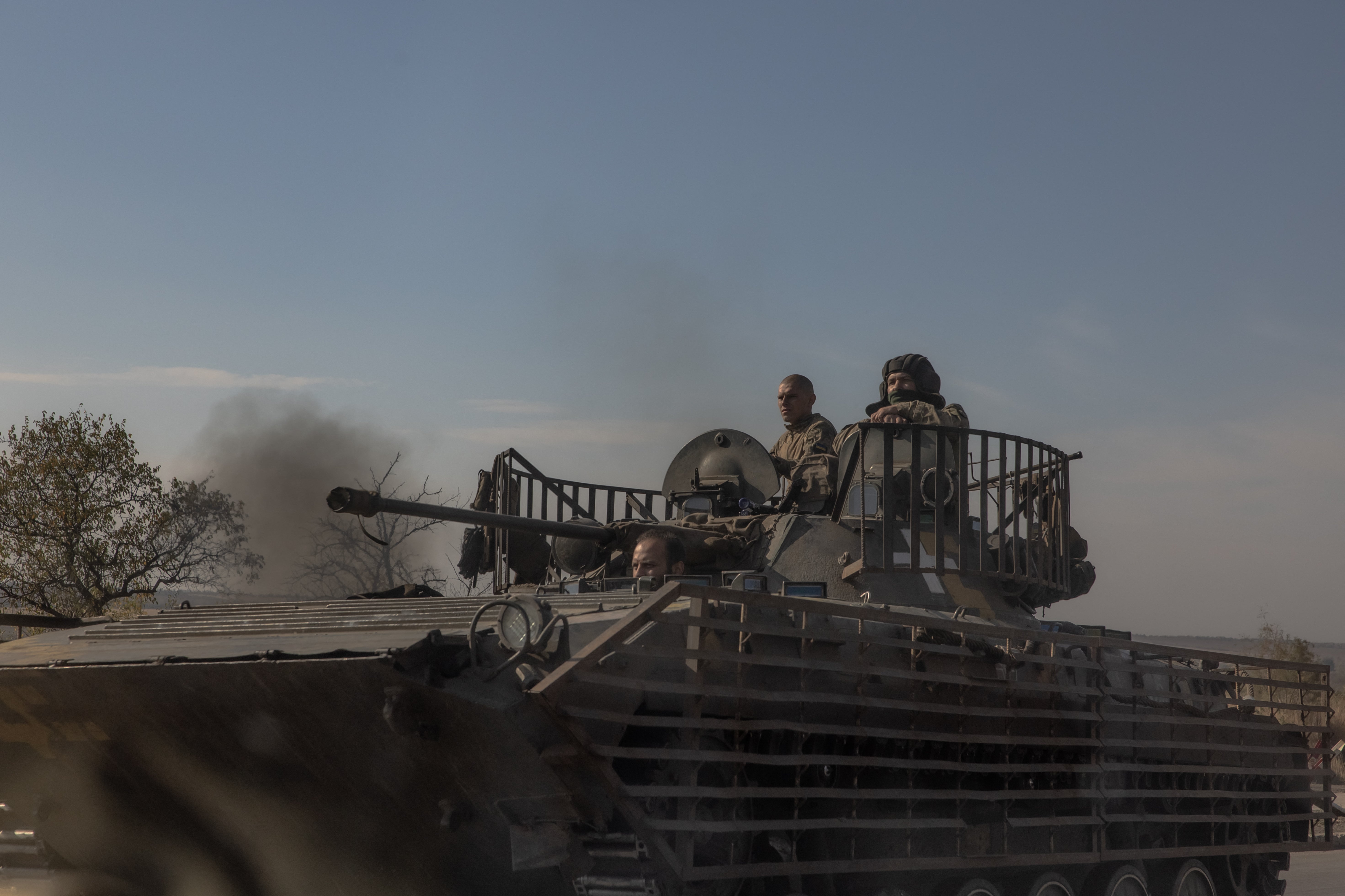 Ukrainian troops cross a road in Donetsk amid the Russian invasion