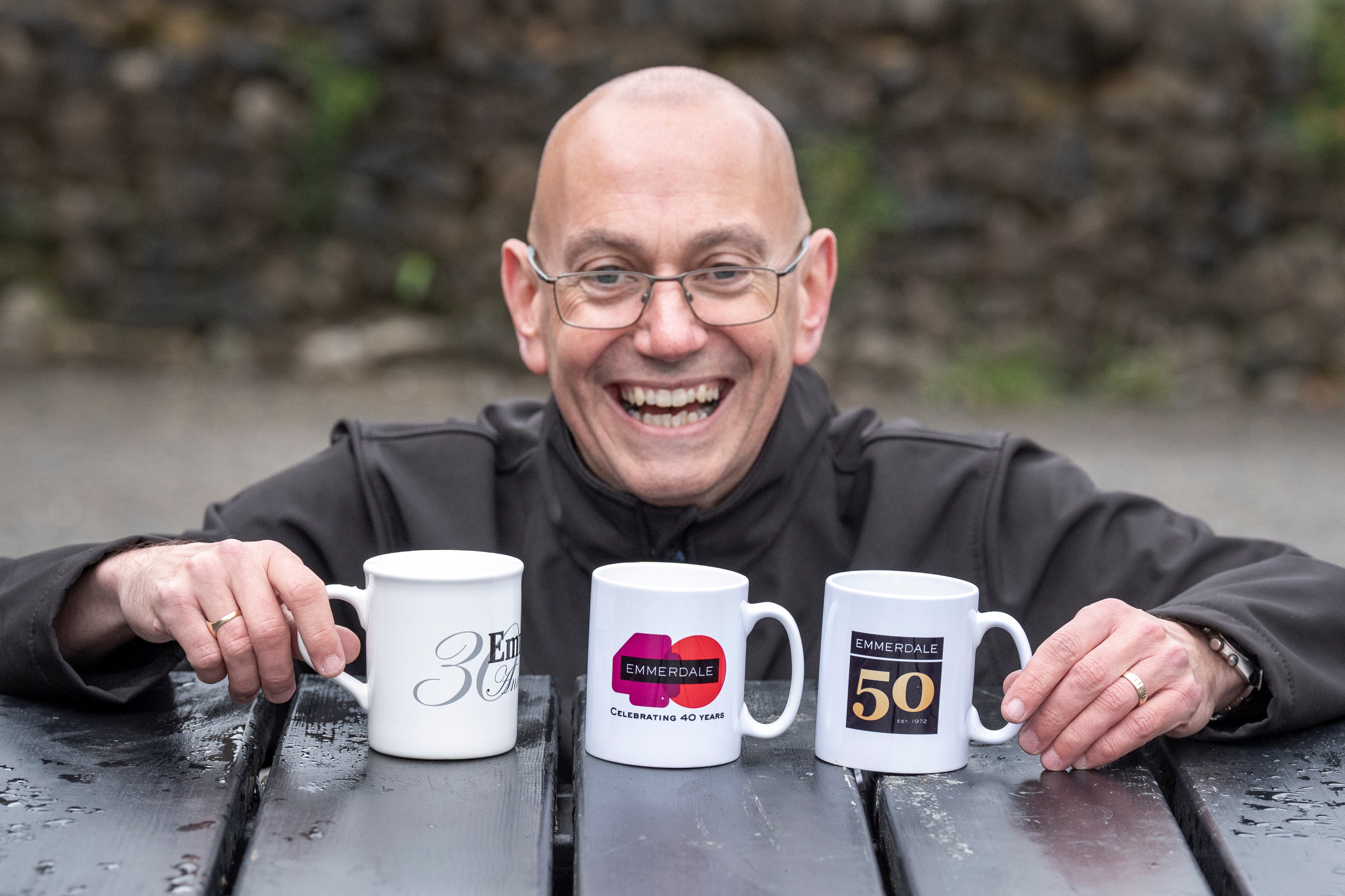 Steve with his 30, 40 and 50 year Emmerdale anniversary mugs