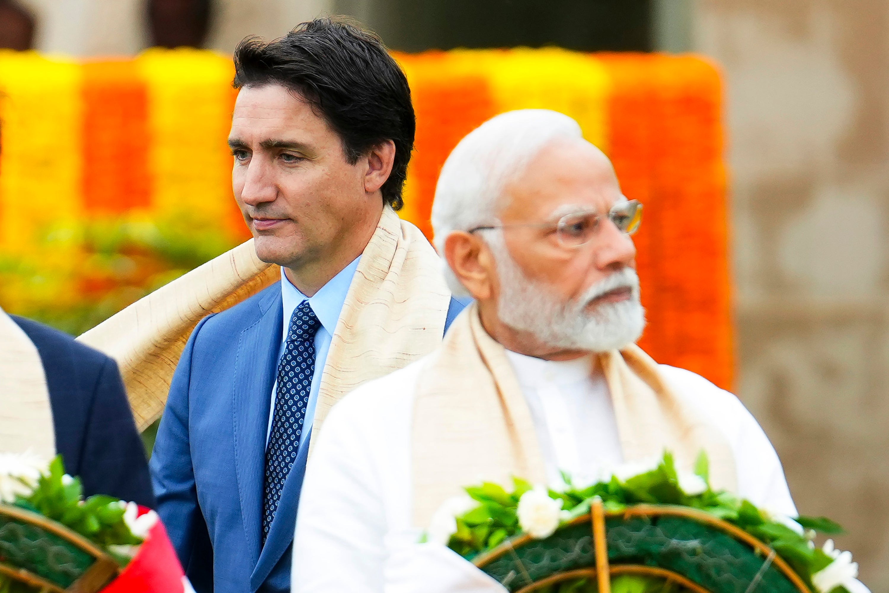 Canada's Prime Minister Justin Trudeau, left, walks past India's Prime Minister Narendra Modi in 2023