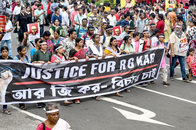 <p>Doctors and social activists take part in a rally condemning the rape and murder of a trainee doctor in Kolkata, India </p>