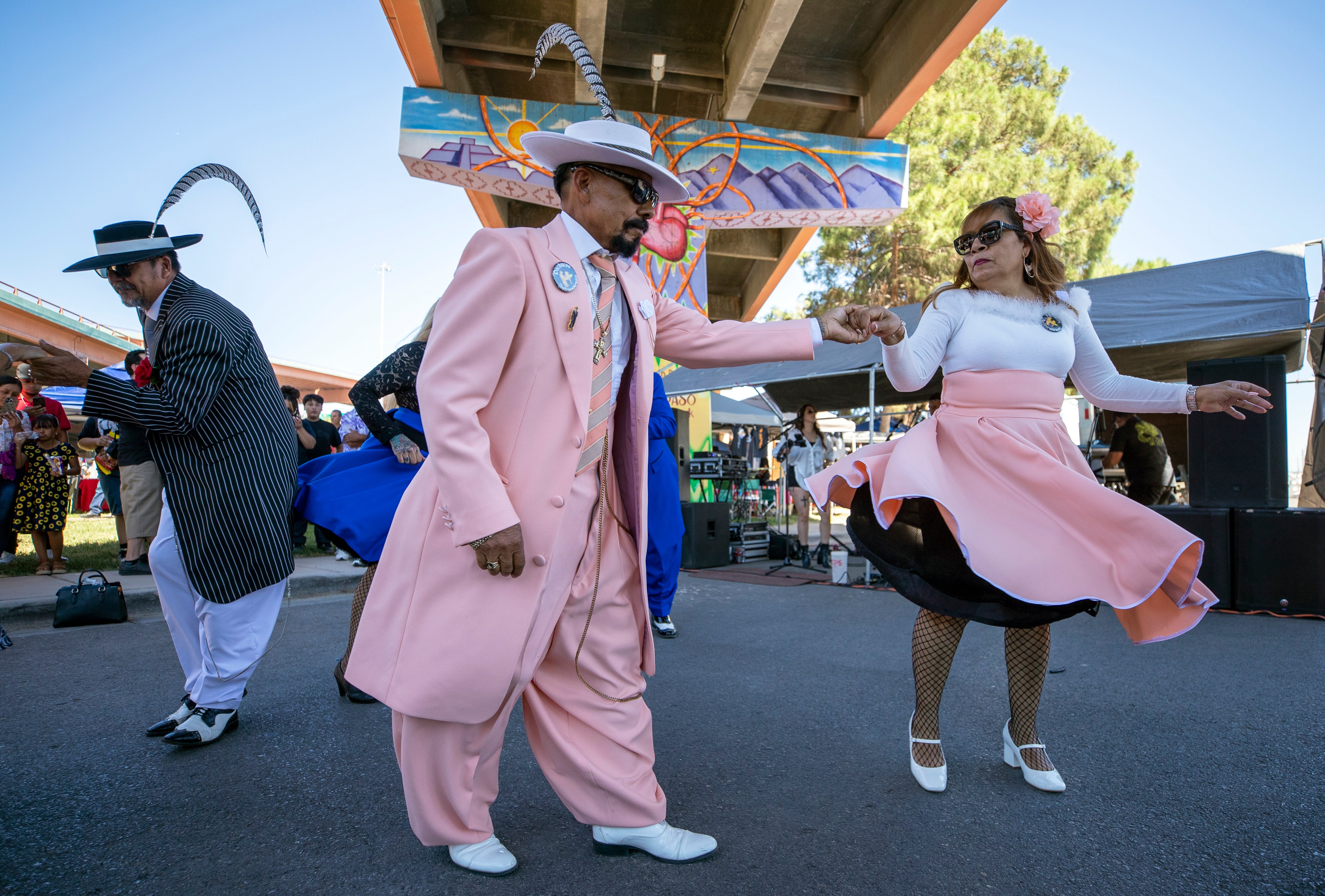 Hugo Cardenas and Araceli Martinez, wearing Zoot suits of the Mexican American subculture known as Pachuco