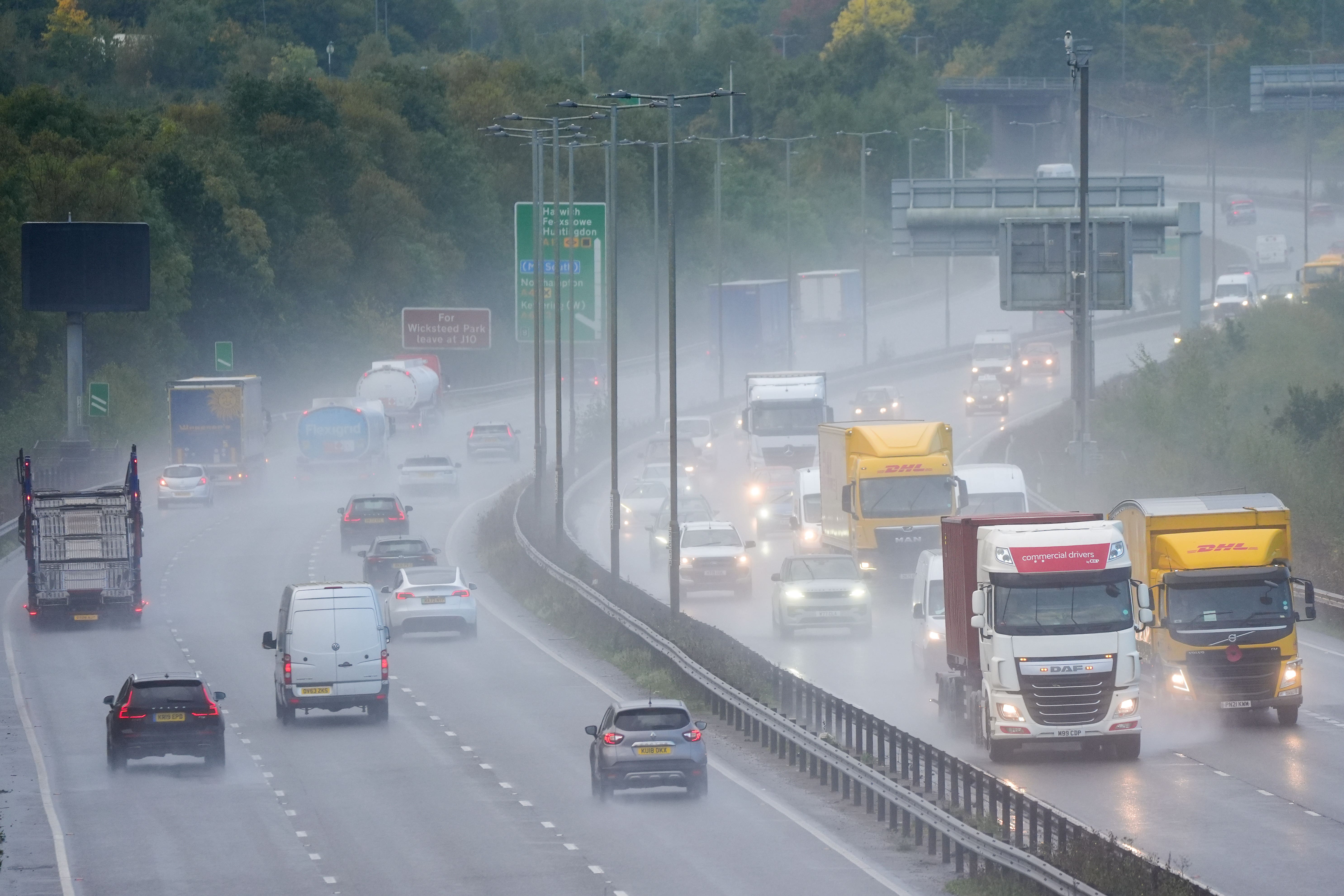 Motorists drive along the A14 near Kettering in Northamptonshire in stormy weather (Joe Giddens/PA)