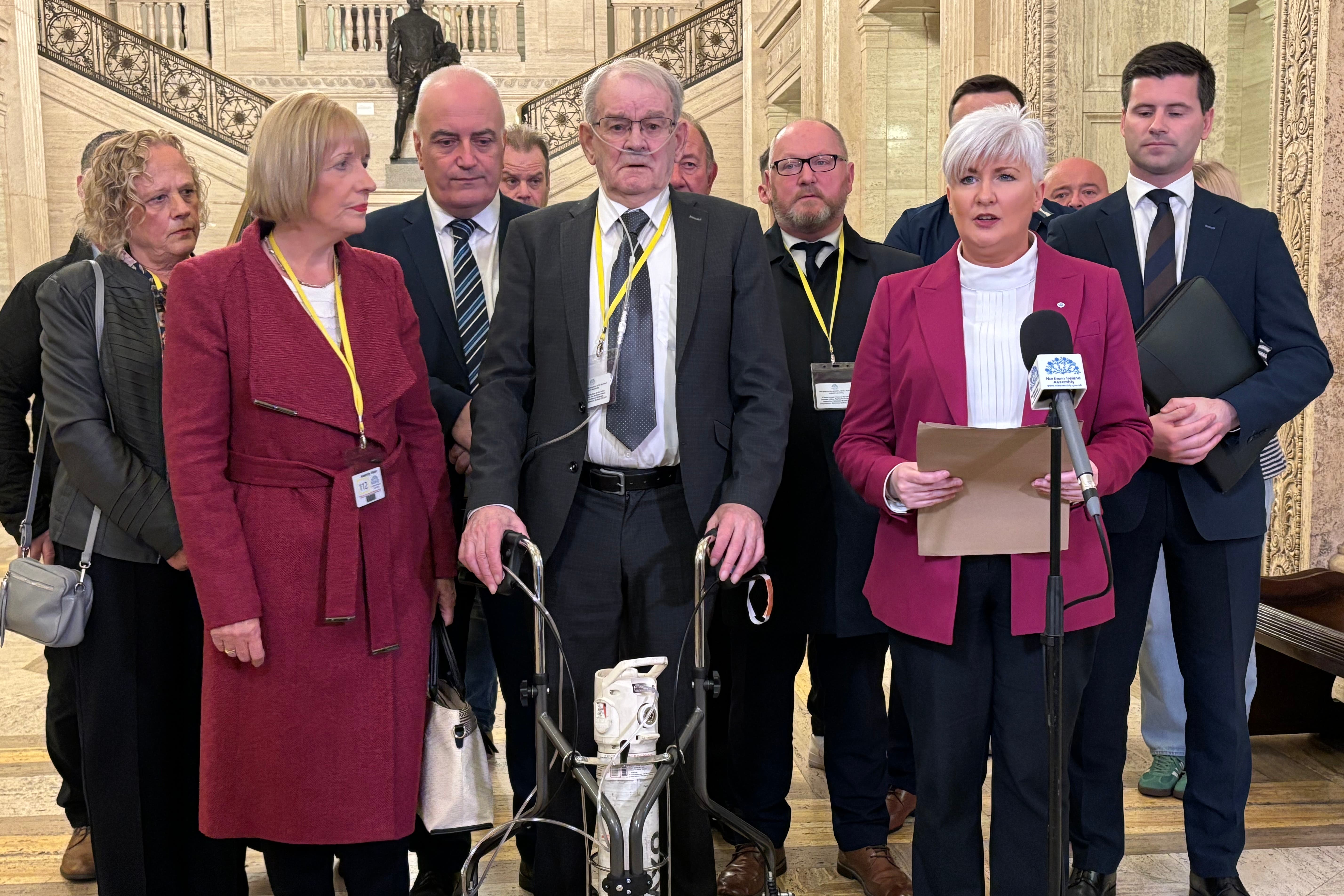 Survivor of the Kingsmill massacre Alan Black, pictured centre (Rebecca Black/PA)