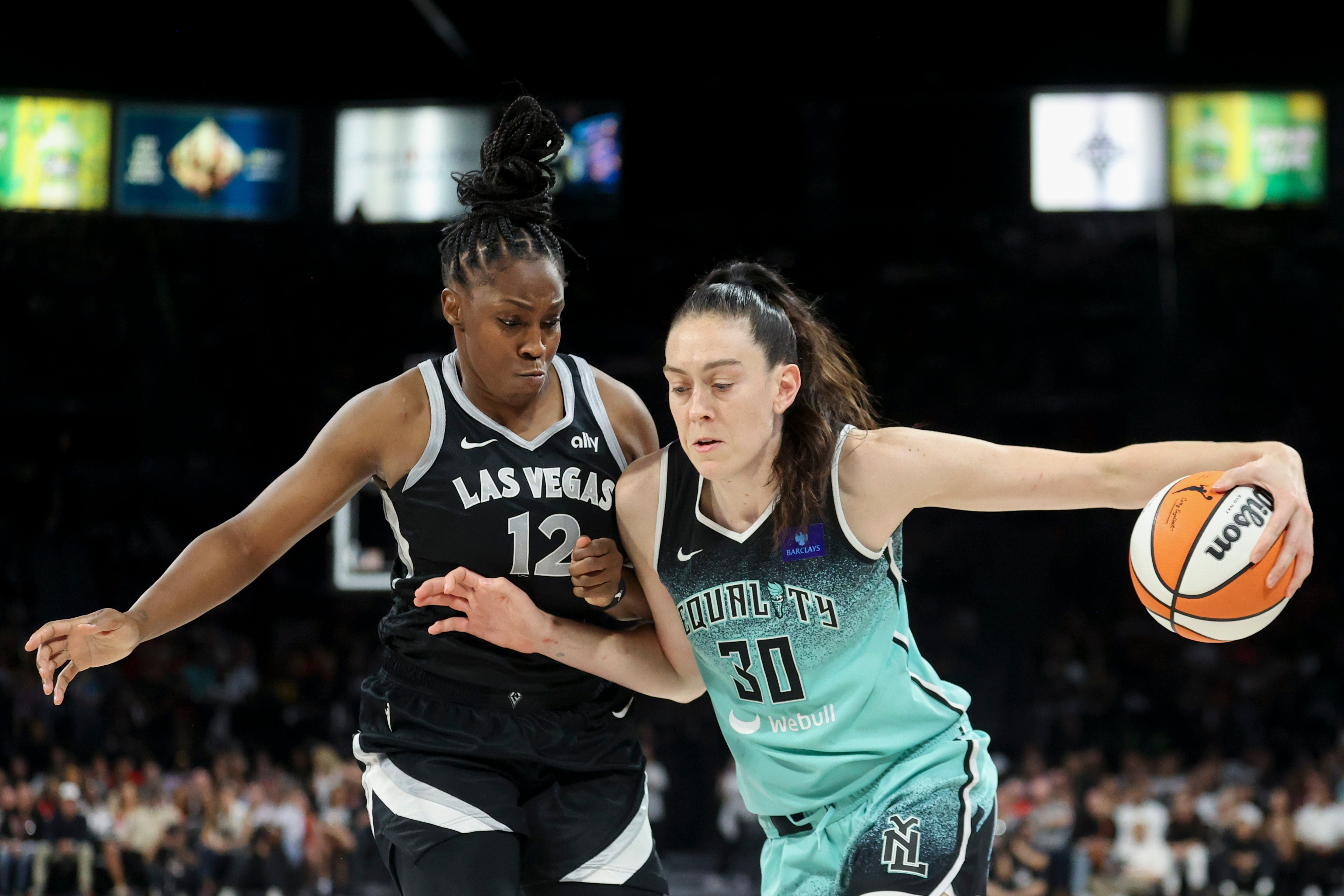 New York Liberty forward Breanna Stewart (30) drives past Las Vegas Aces guard Chelsea Gray (12)