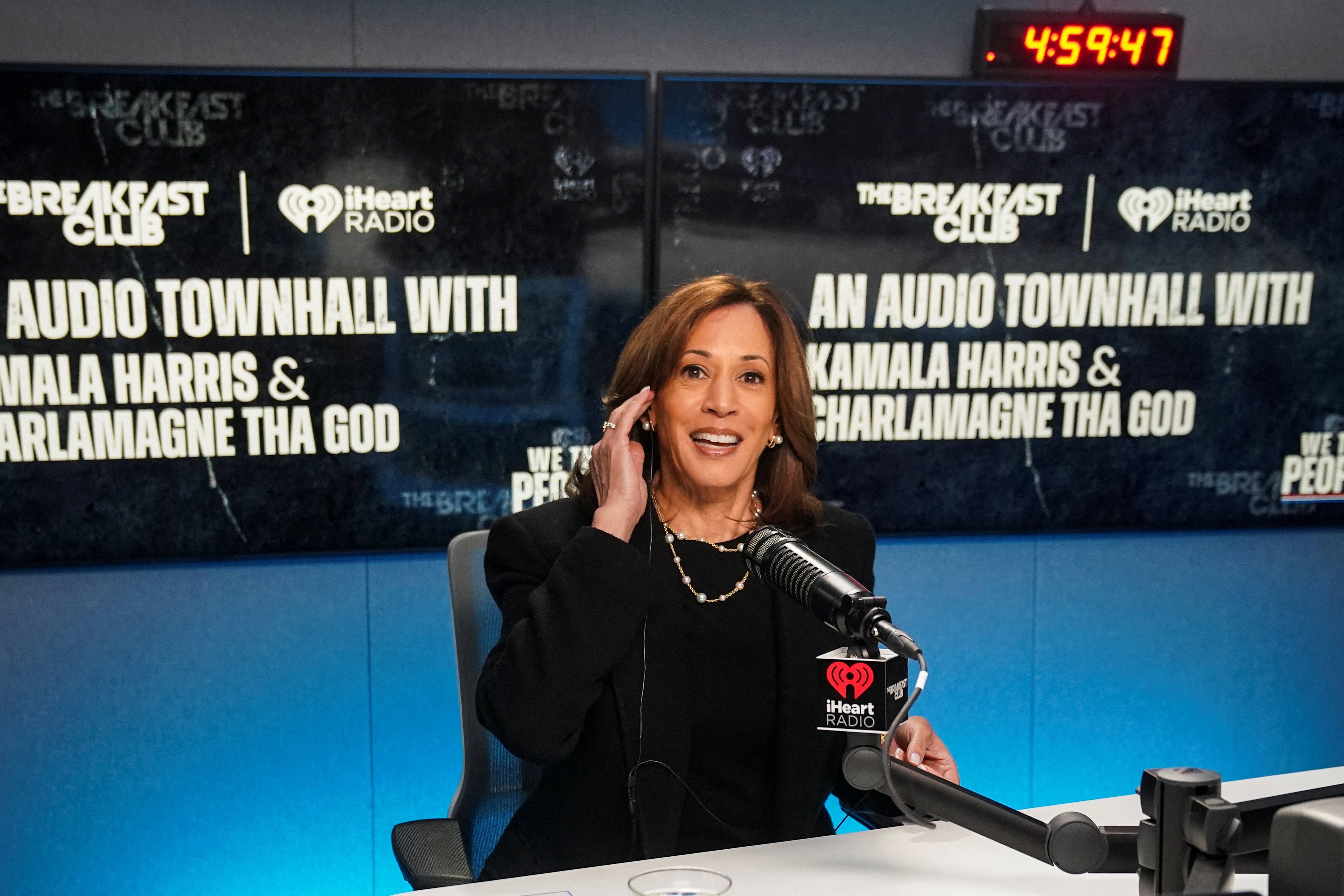 Democratic presidential nominee US Vice President Kamala Harris looks on as she participates a "town hall" with radio host Charlamagne Tha God, in Detroit, Michigan