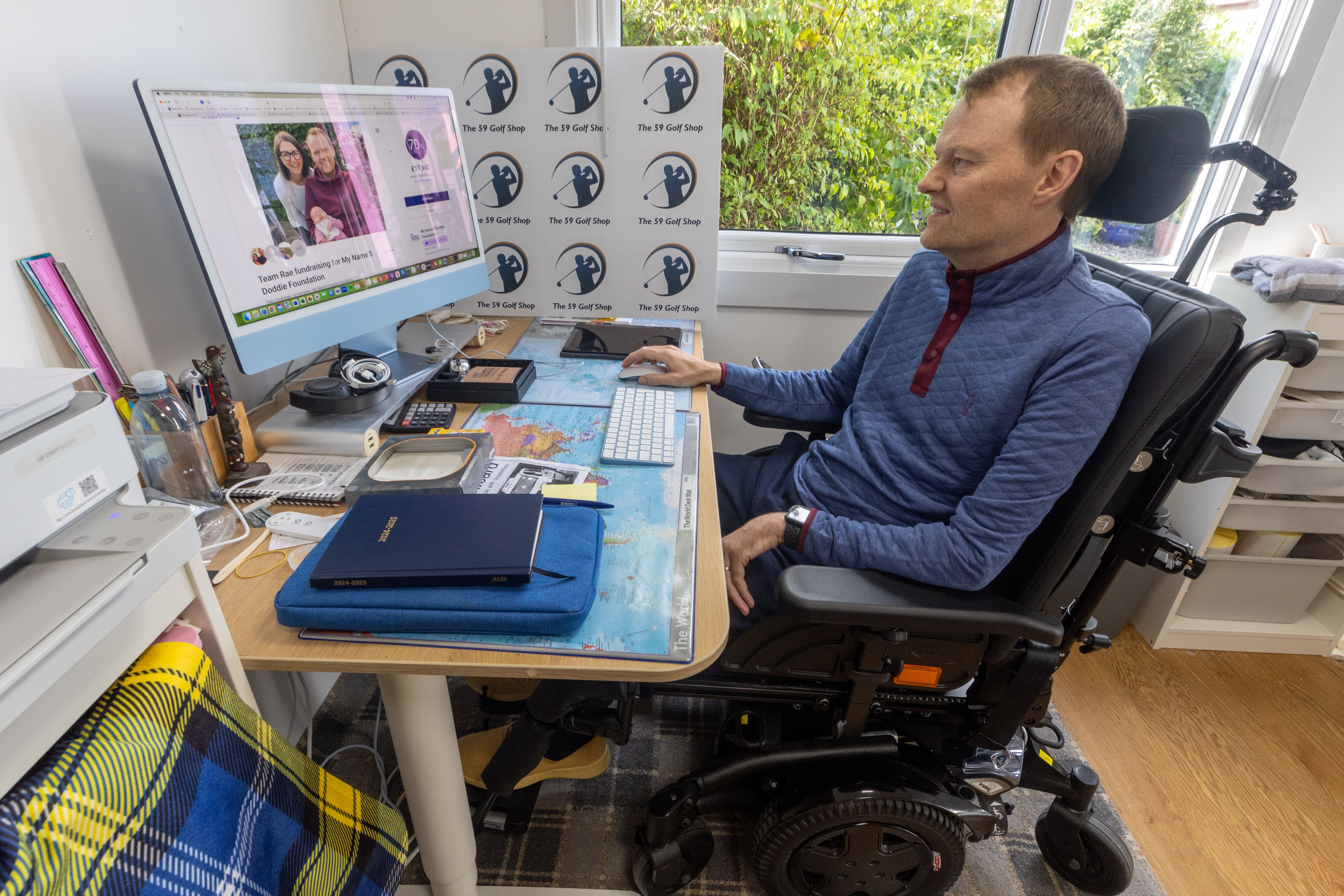 Scott Stewart at his desk at home in Stirling (My Name’5 Doddie Foundation/PA)