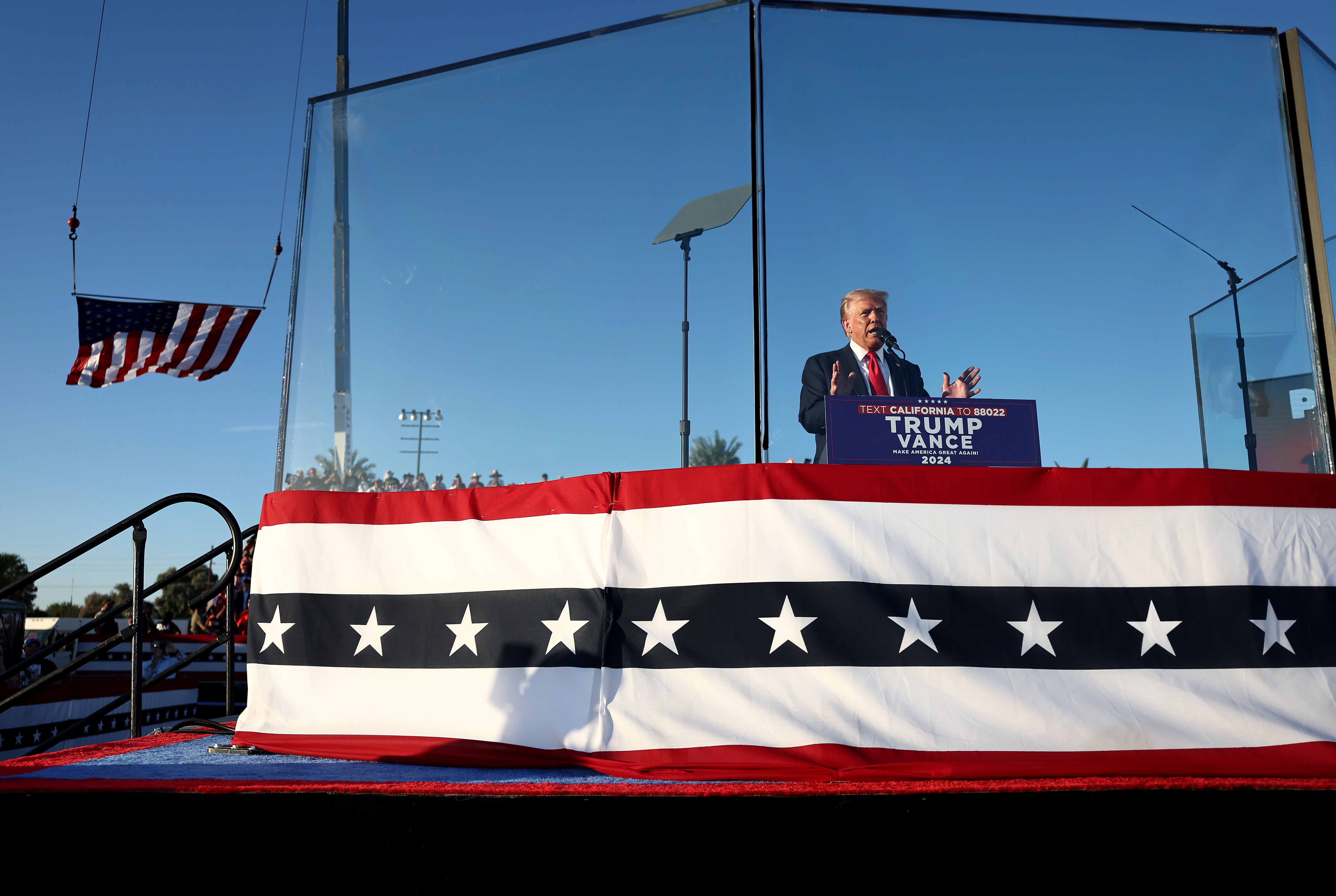 After two assassination attempts, Trump is now shielded by bulletproof panels at large campaign events