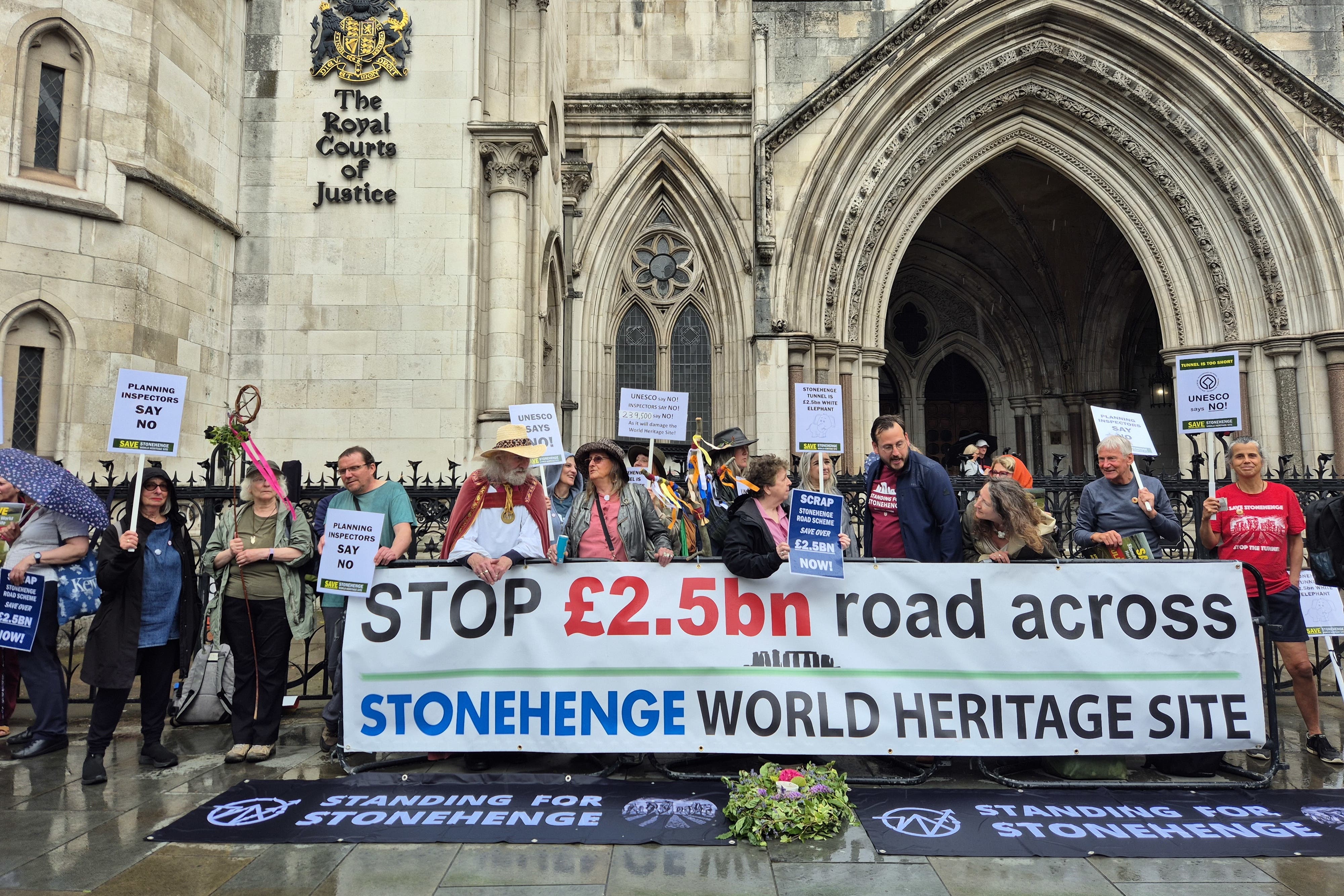 Protesters outside the Royal Courts of Justice (PA)