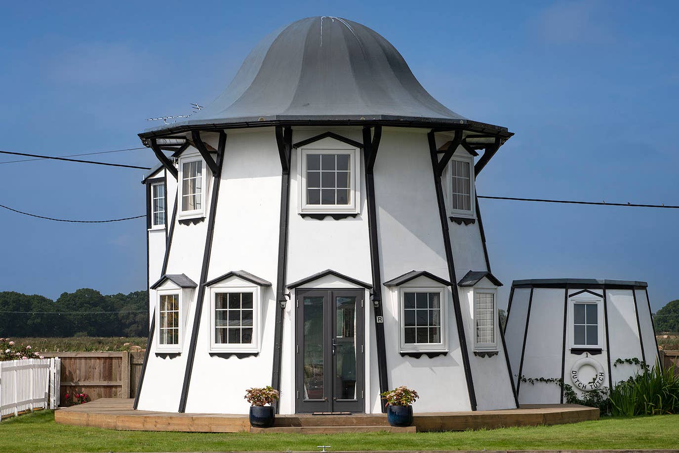 Dutch Tutch, on the River Thurne in Potter Heigham, Norfolk, was constructed from an old helter-skelter (Historic England Archive/PA)