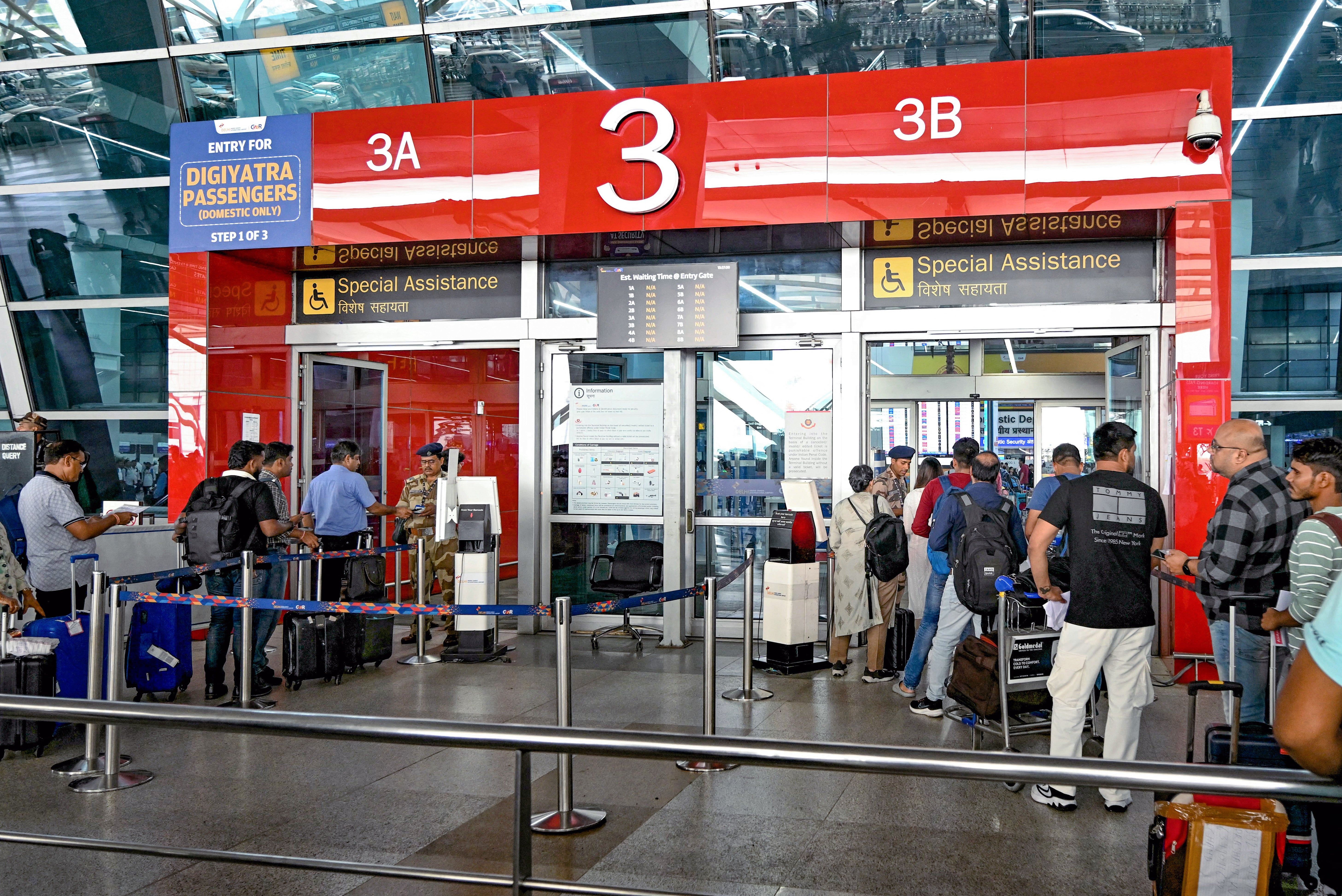 Passengers go through a security checkpoint at the New Delhi airport on 19 July 2024