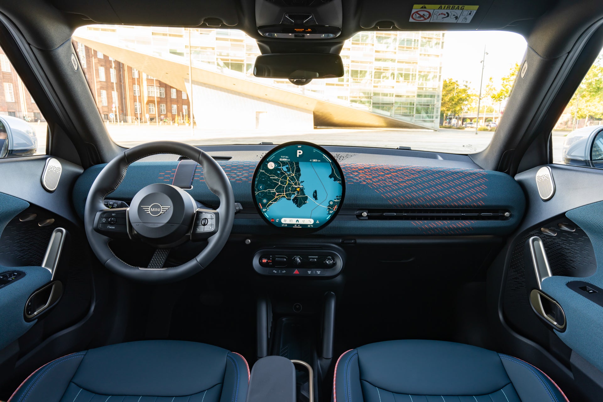 The interior is similar to that of the Cooper and Countryman, with a striking circular display