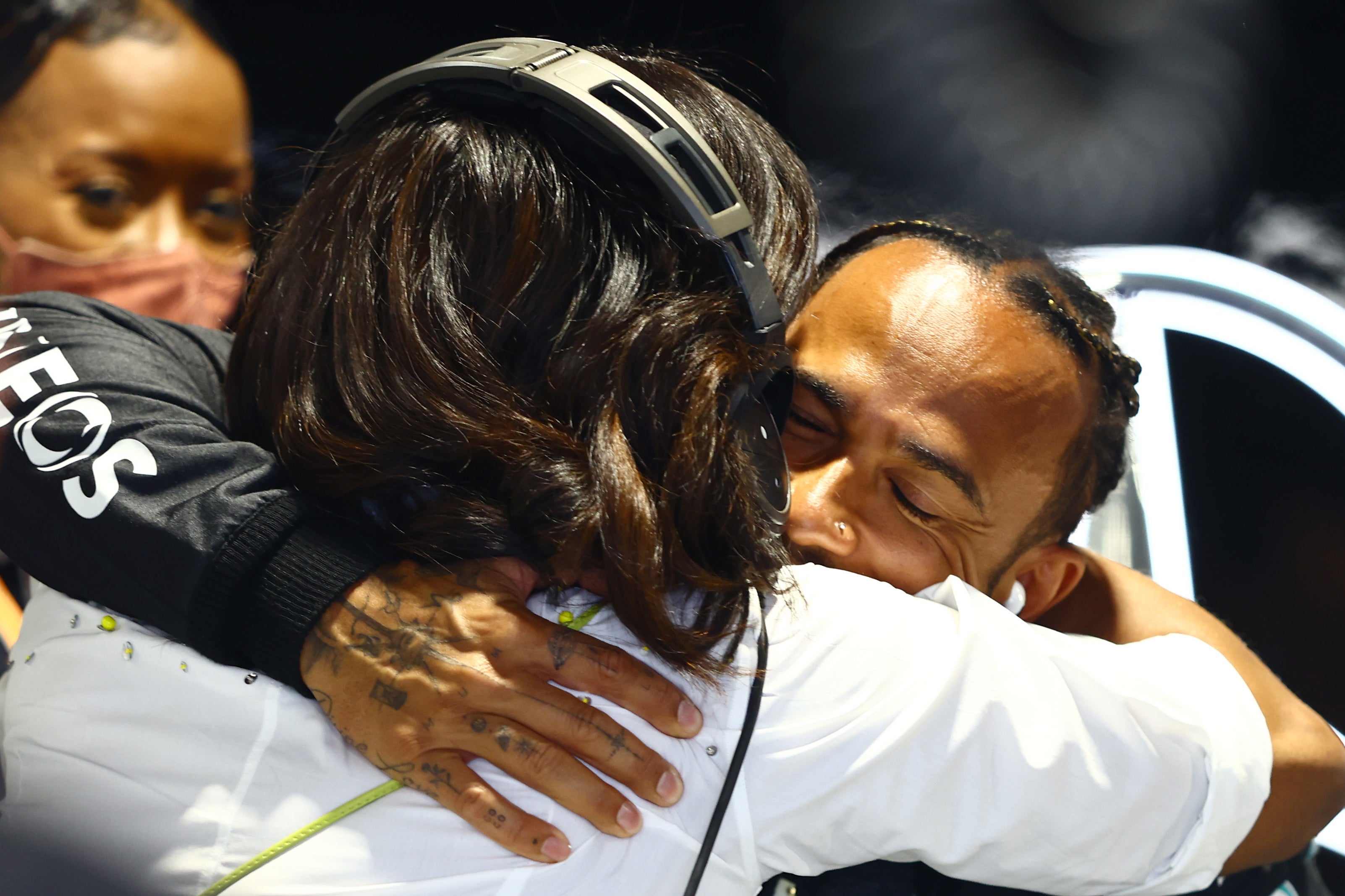 Lewis Hamilton hugs former first lady Michelle Obama at the 2022 Miami Grand Prix