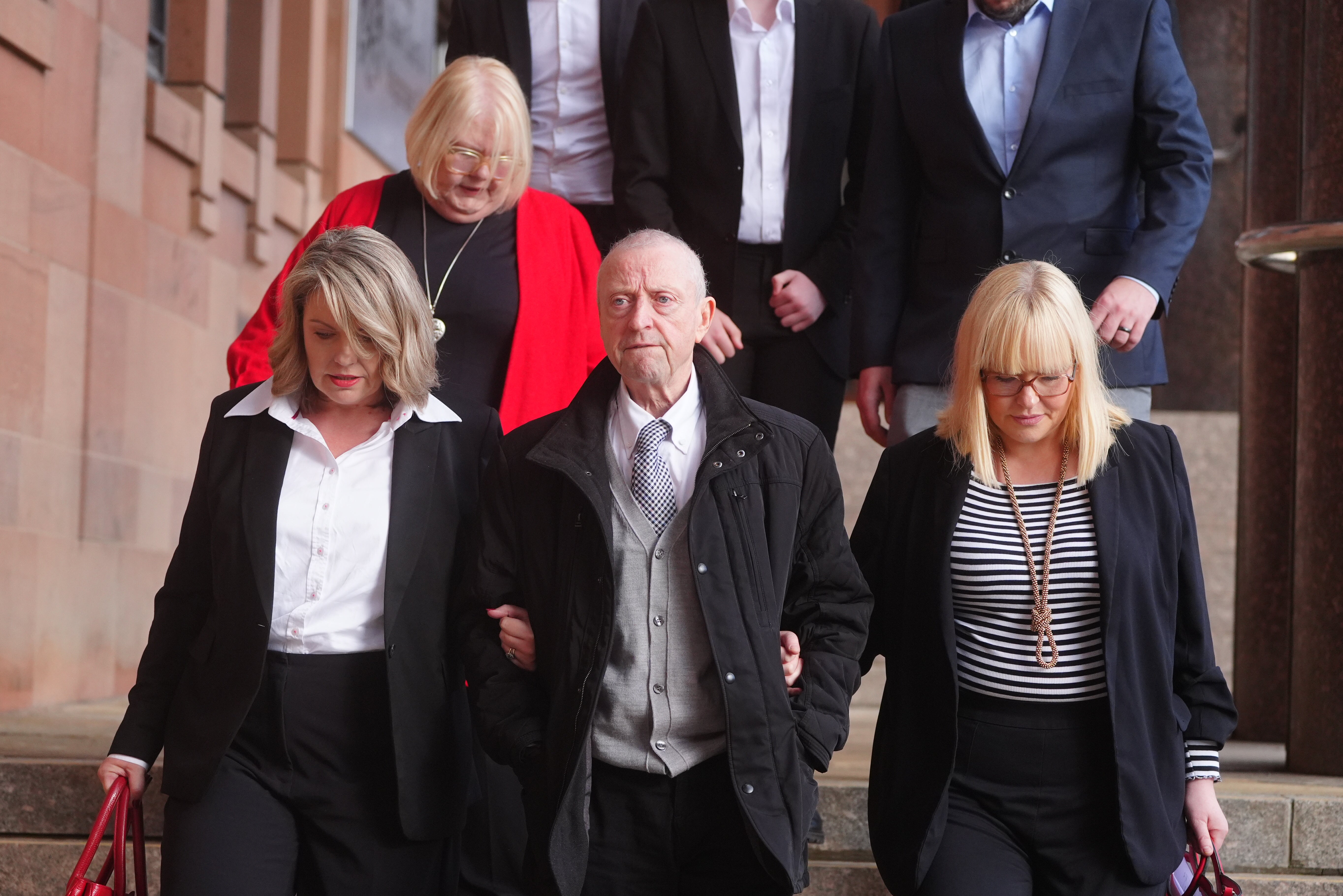 Victim Patrick O'Hara, centre, leaves Newcastle Crown Court on Thursday