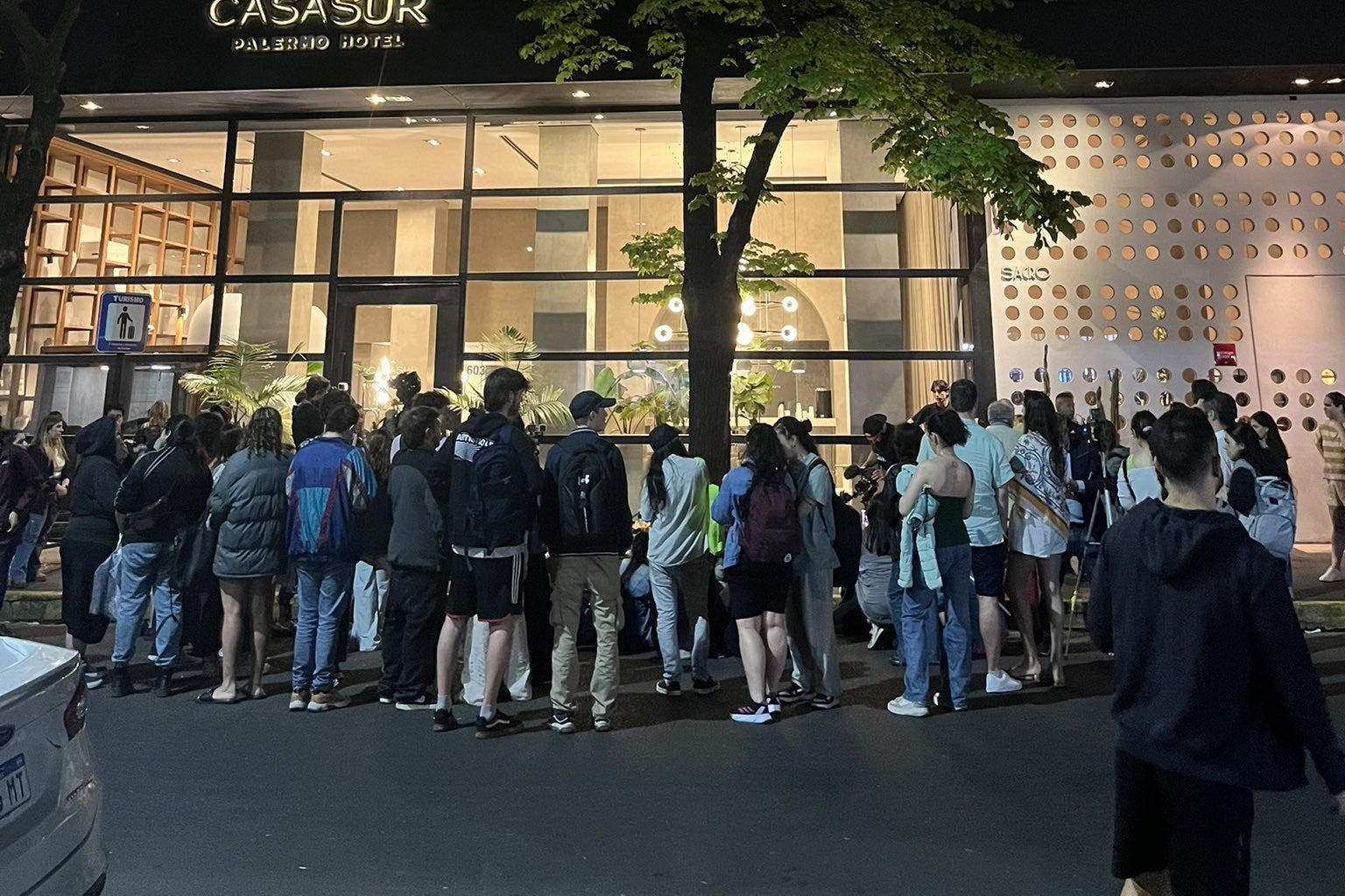 Fans holding a vigil for Liam Payne on Wednesday evening outside the Casa Sur Hotel in the Palermo area of Buenos Aires (Siobhan Brier Aguilar/PA)