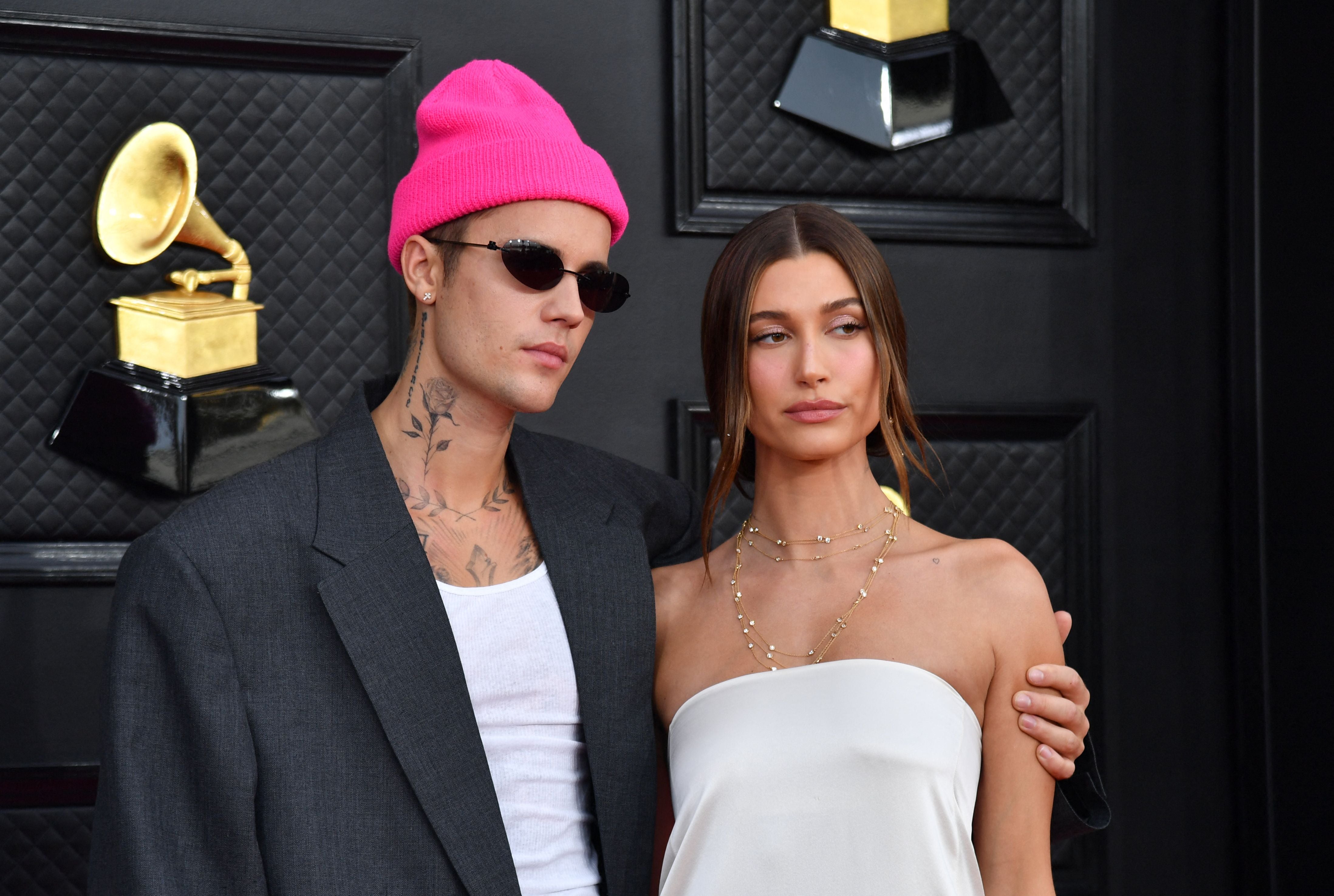 Canadian singer-songwriter Justin Bieber (L) and US model Hailey Bieber arrive for the 64th Annual Grammy Awards in 2022