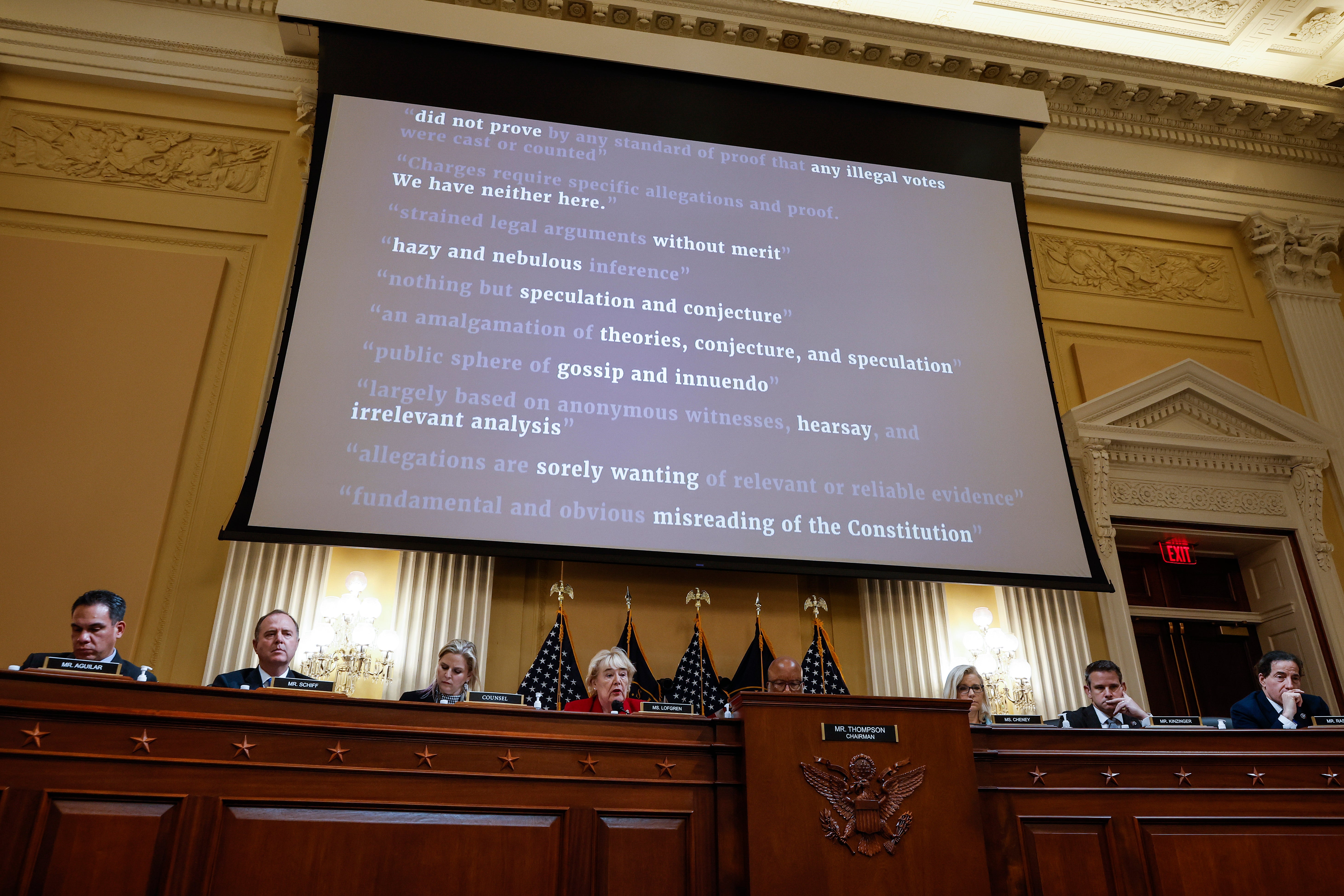 A screen displays quotes from judges who dismissed cases of former President Trump's fraud claims for the 2020 election during a hearing by the Select Committee to Investigate the January 6th Attack on the US