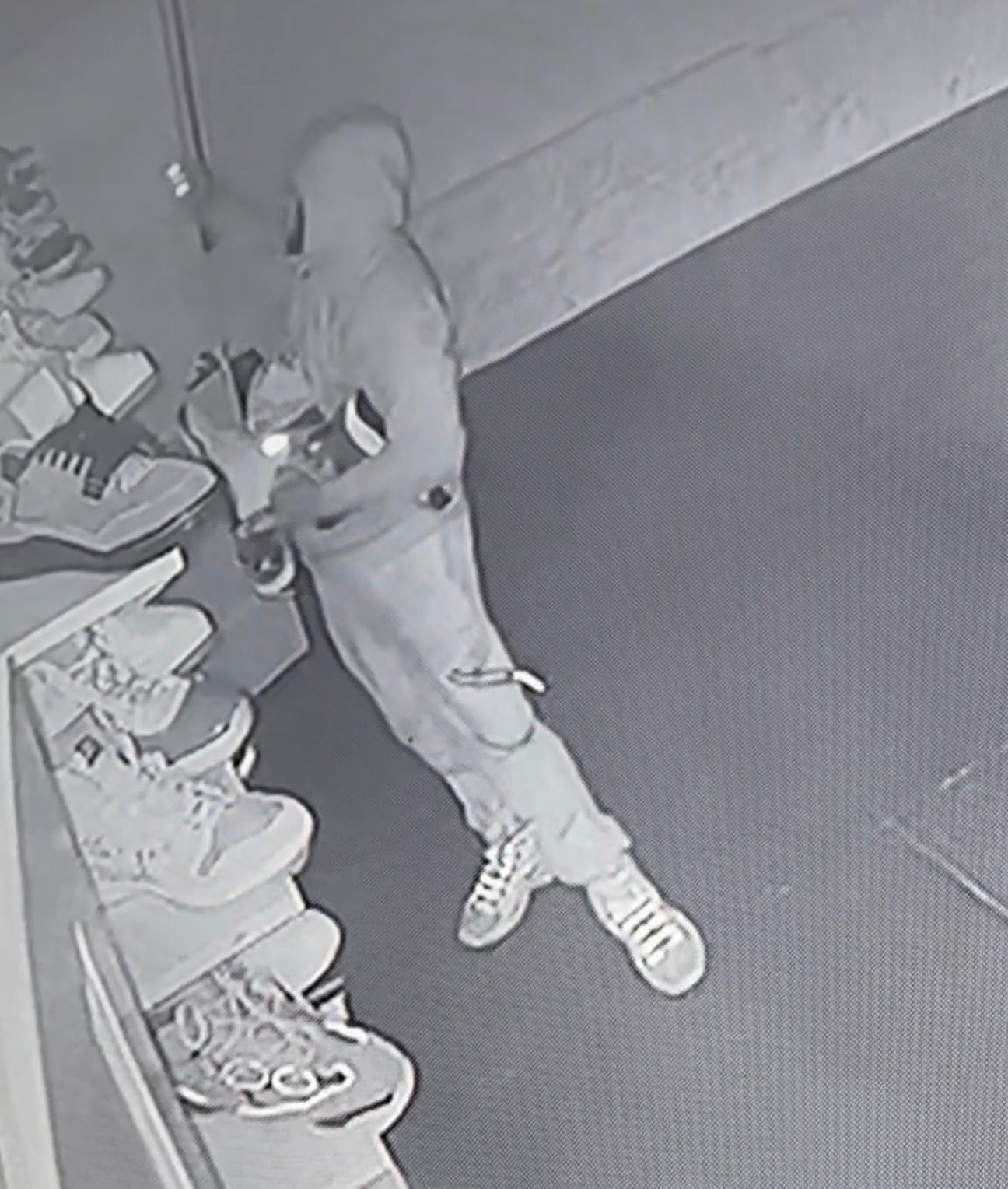 A robber seen in security footage taking shoes from the Sole Bros 513 shoe store in Cincinnati