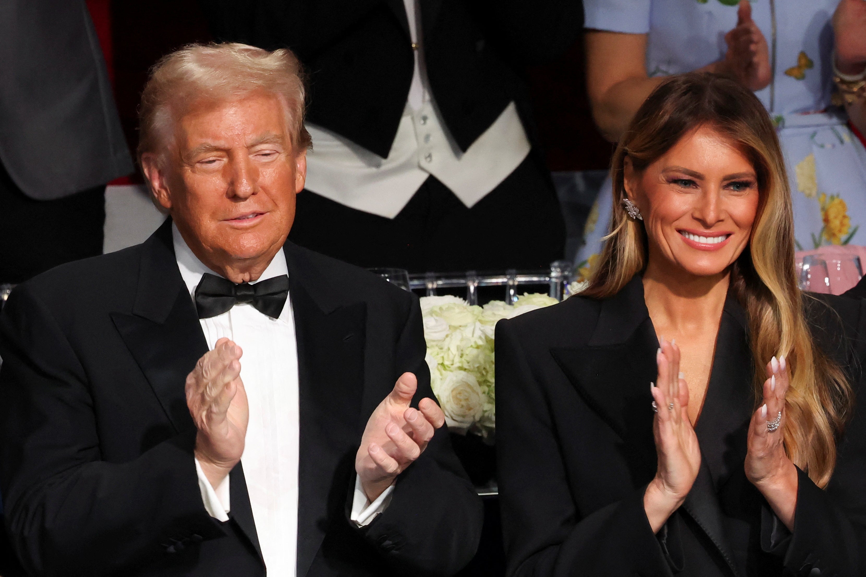 Melania and Donald are all smiles as they make rare public outing