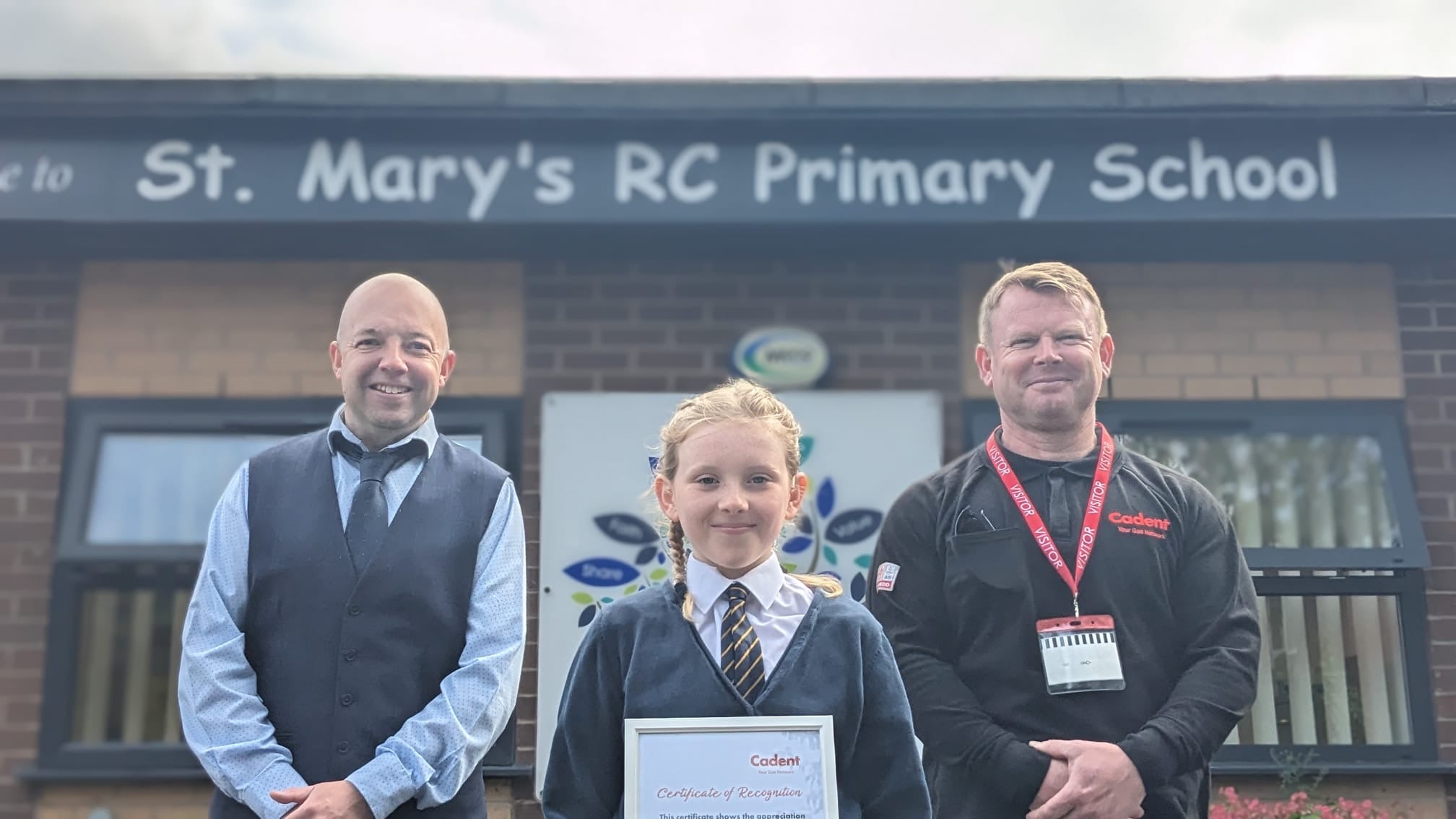 Connie with Chris, the Cadent engineer who presented her with an award, and headteacher Stuart Hewson