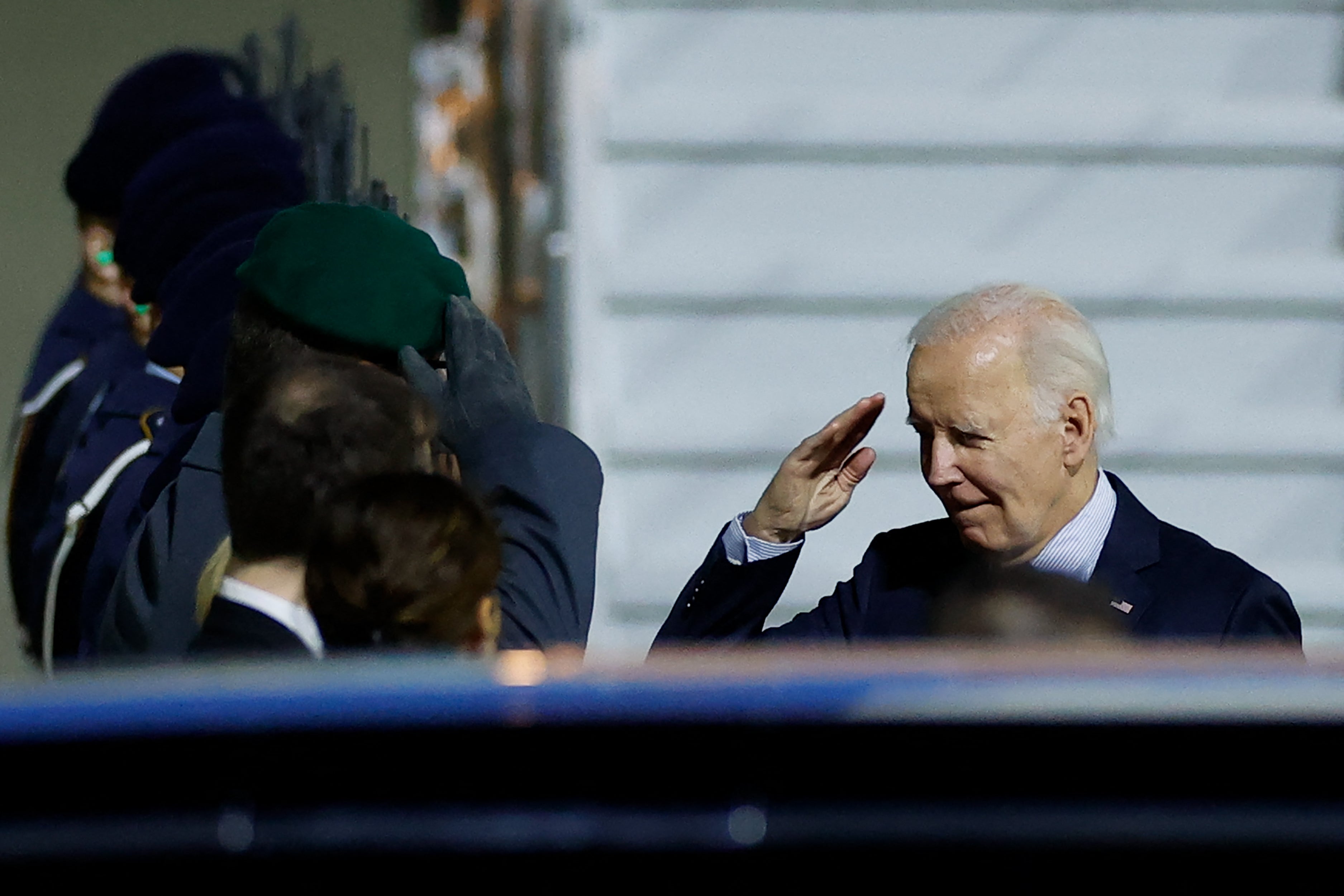 Biden salutes German soldiers after disembarking from Air Force One upon arrival at Berlin-Brandenburg Airport (BER)