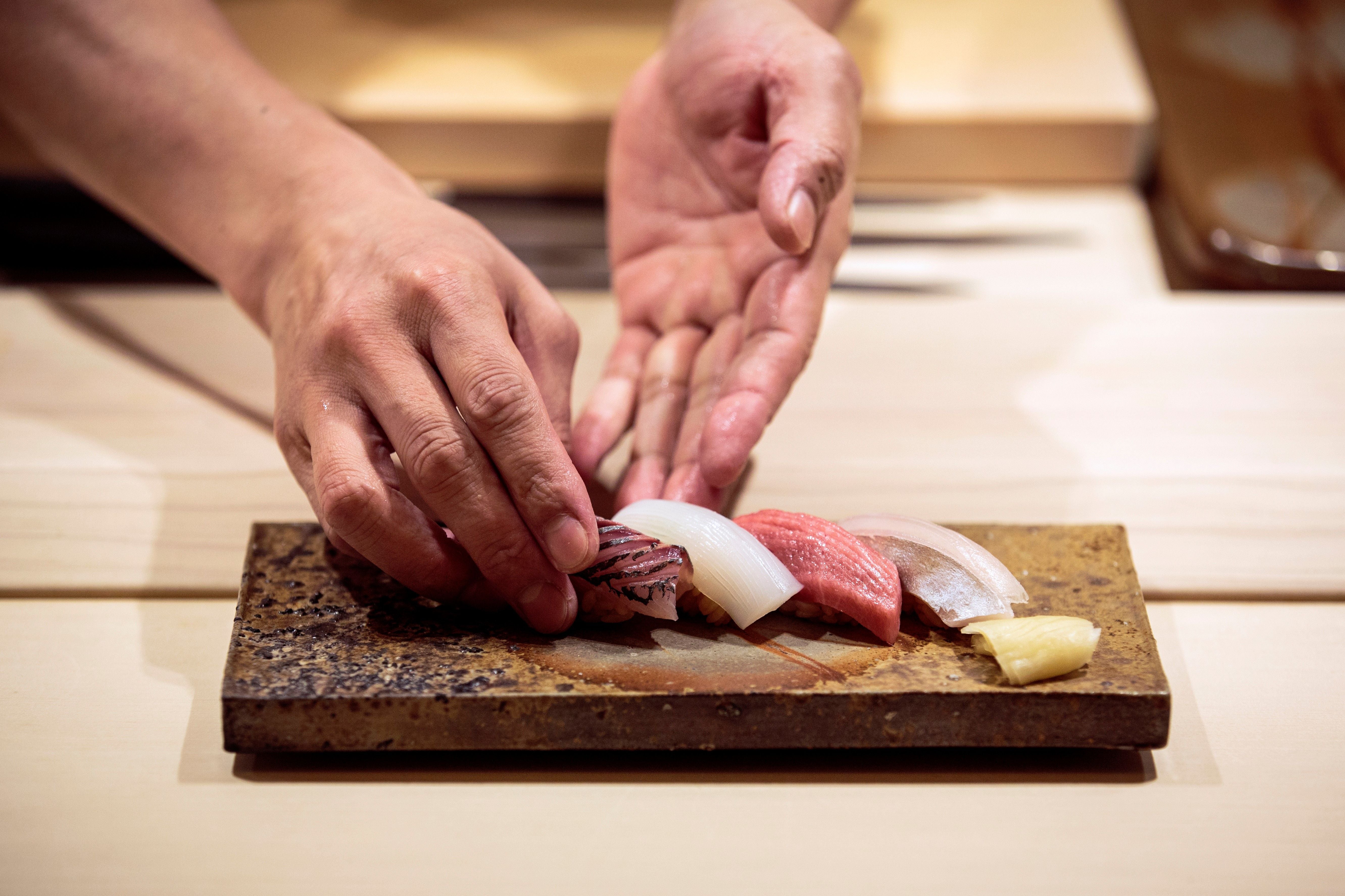 Chief Akifumi Sakagami makes a sushi set at Sushi Ginza Onodera restaurant in Tokyo