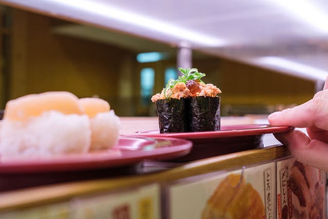 <p>File. Plates of sushi on a conveyor belt at a restaurant in Tokyo, Japan </p>