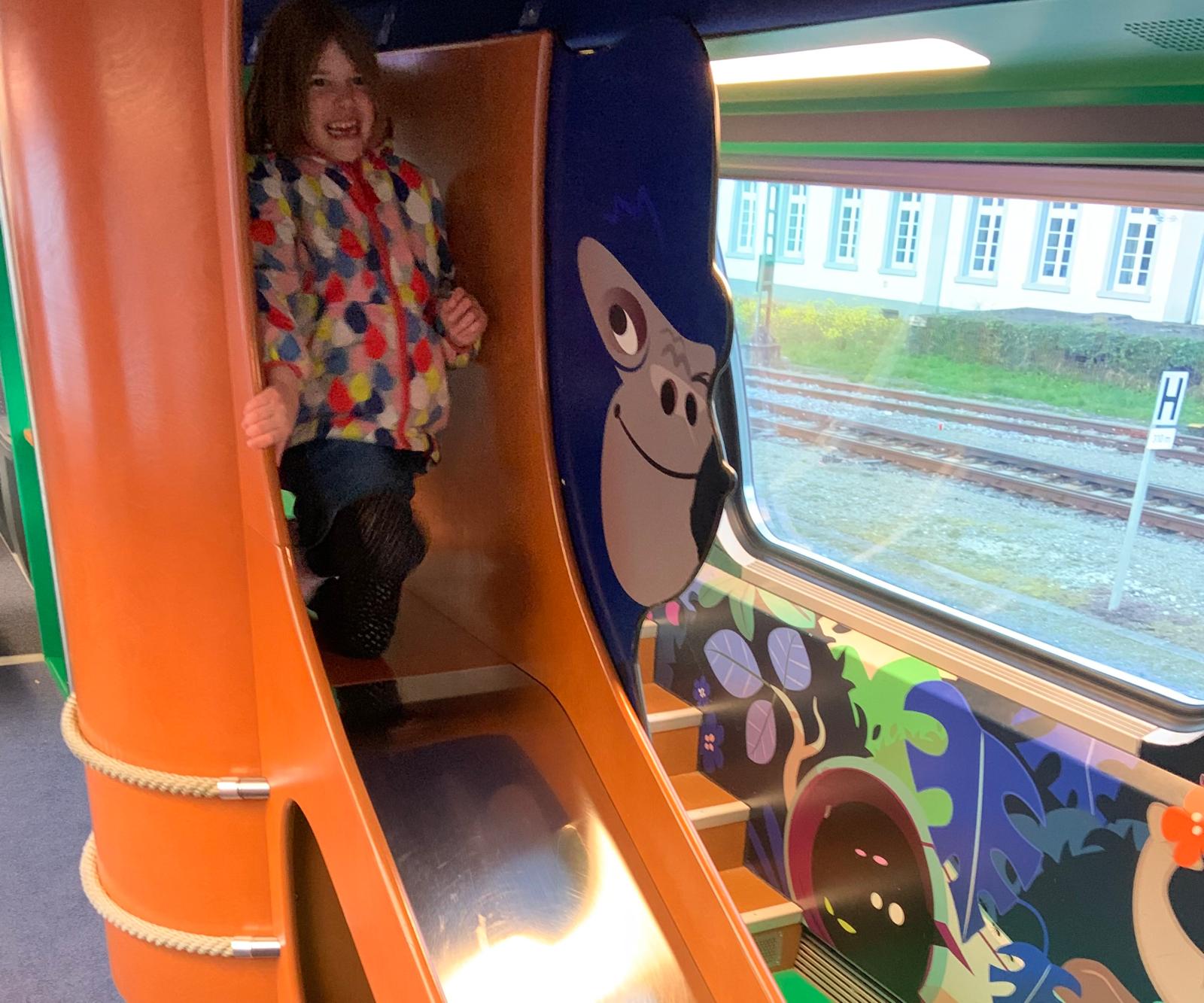 Onboard fun: Anna Ableman, when aged six, in the play area on a Swiss train