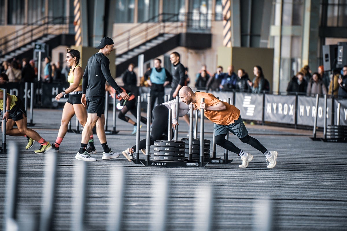 A Hyrox athlete tackling the sled push at the Berlin event