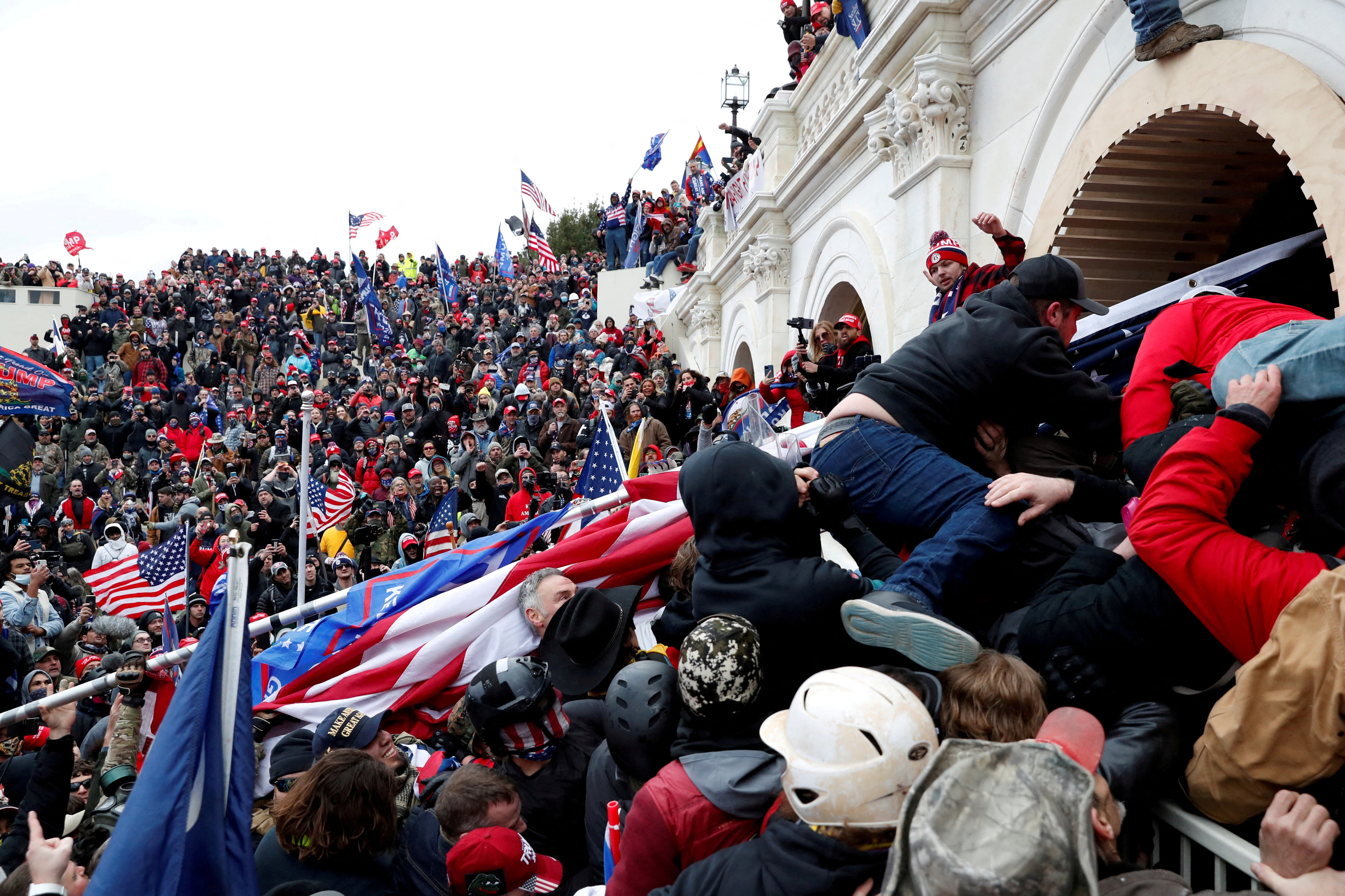 Pro-Trump protesters storm into the US Capitol during clashes with police, during a rally to contest the certification of the 2020 election