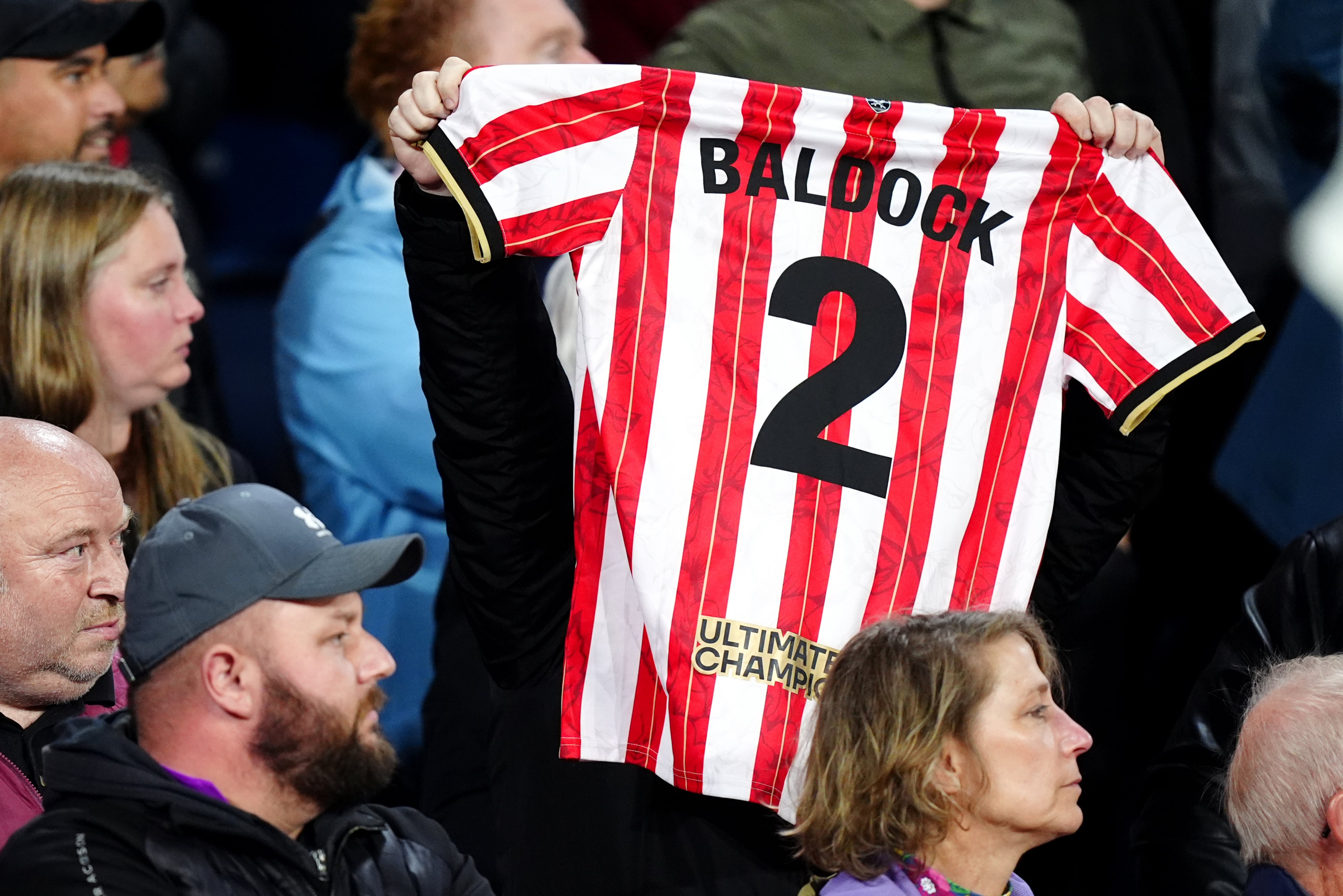 A fan holds up a ‘Baldock’ shirt at Bramall Lane