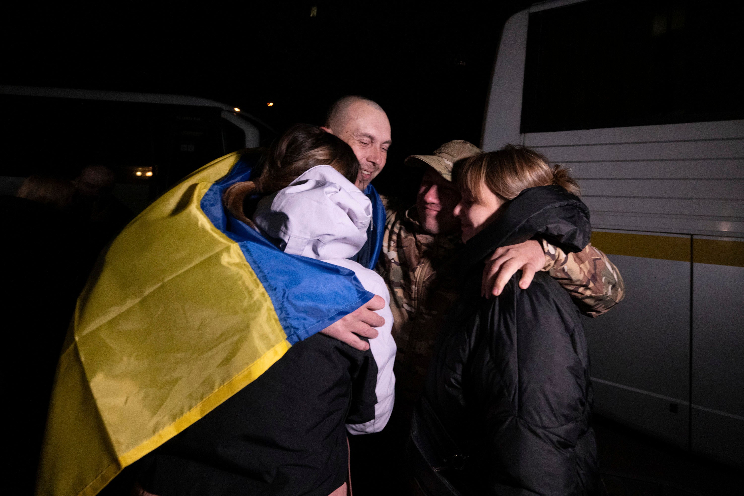 Ukrainian serviceman hugs relatives after returning from captivity