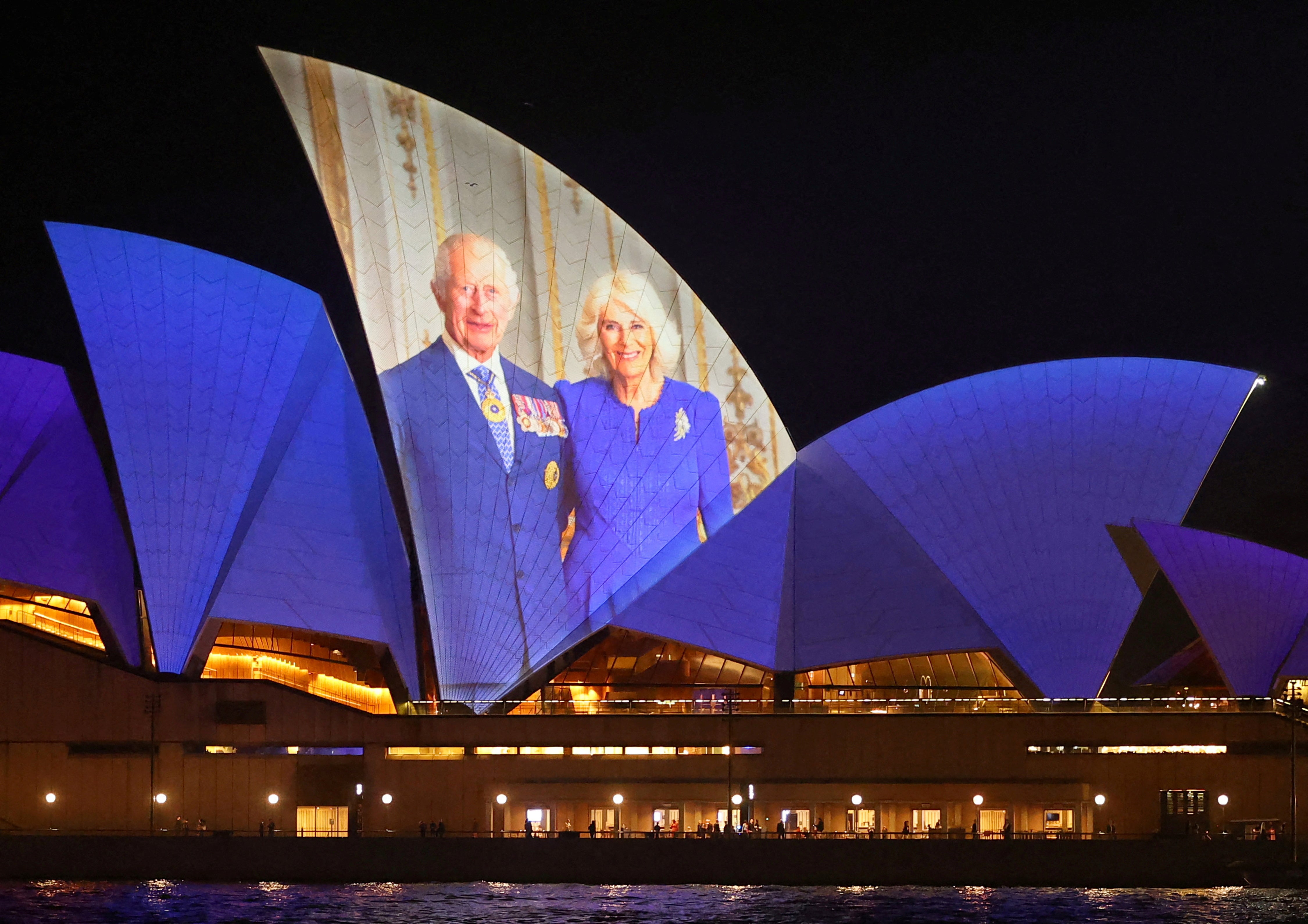 An image of Britain's King Charles and Queen Camilla is projected onto Sydney Opera House