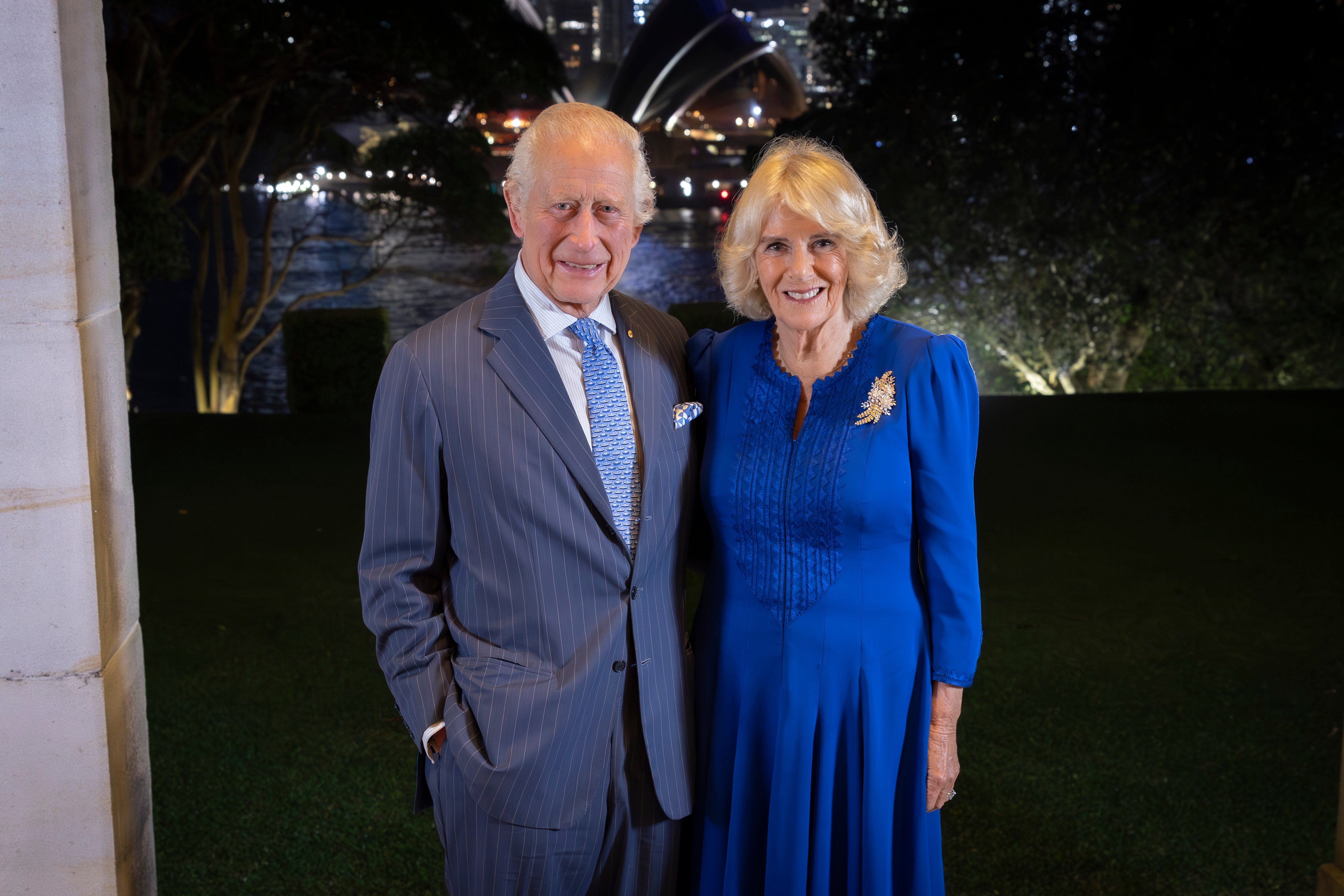 The King and Queen look in good spirits after arriving in Australia on Friday