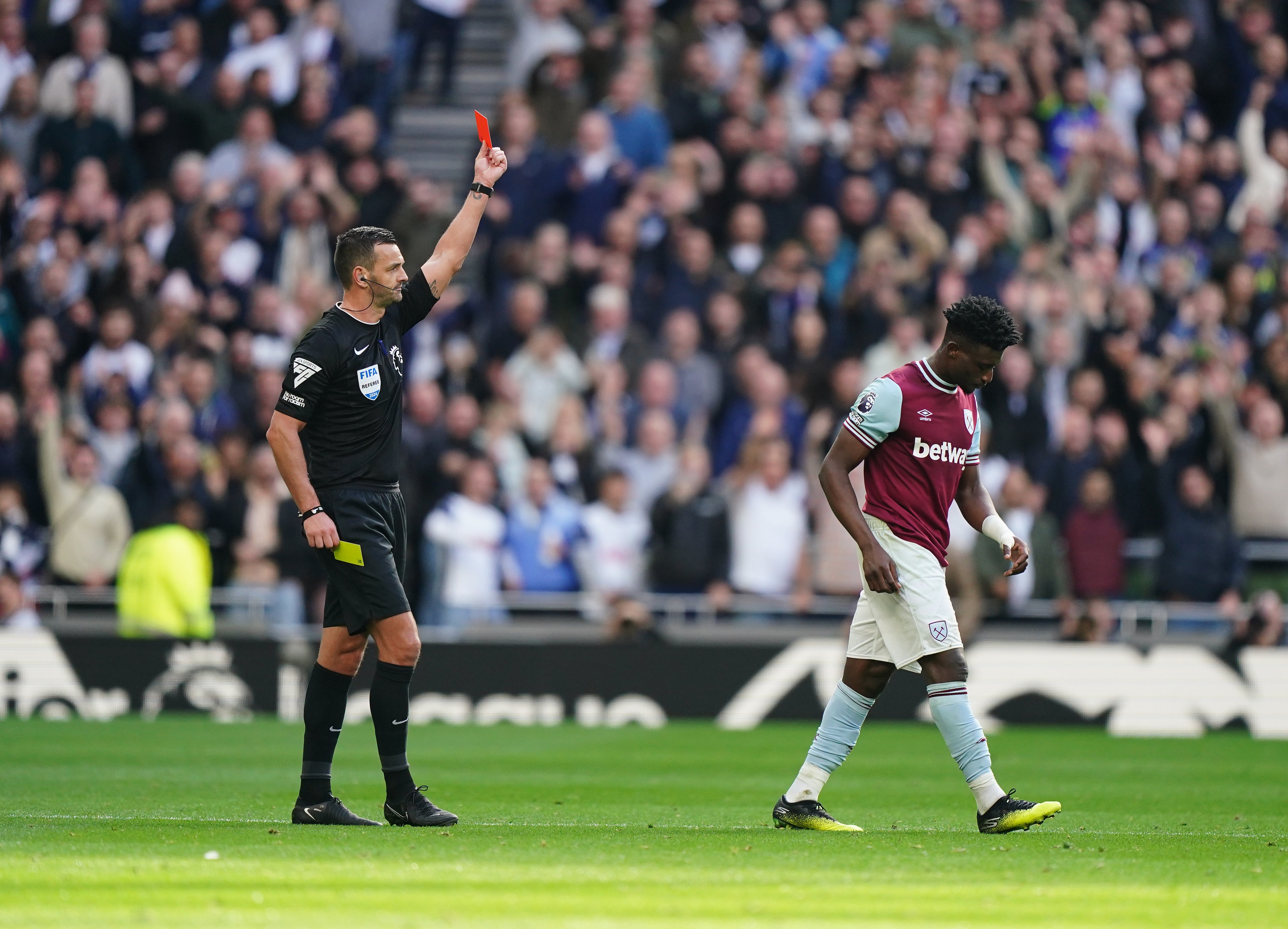 Referee Andrew Madley shows West Ham’s Mohammed Kudus a red card