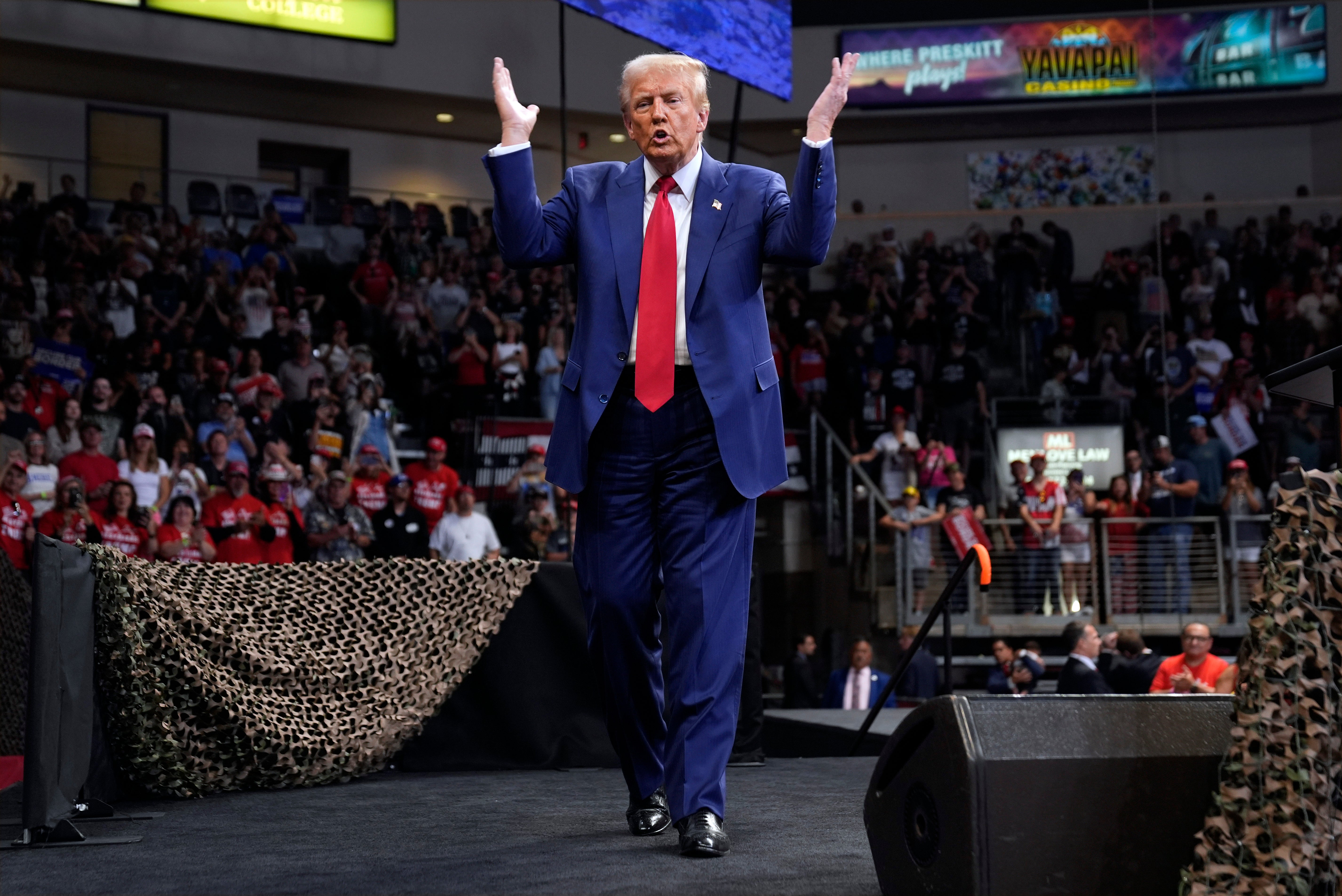 Republican presidential nominee former President Donald Trump gestures at a campaign rally at the Findlay Toyota Arena Sunday, Oct. 13, 2024,