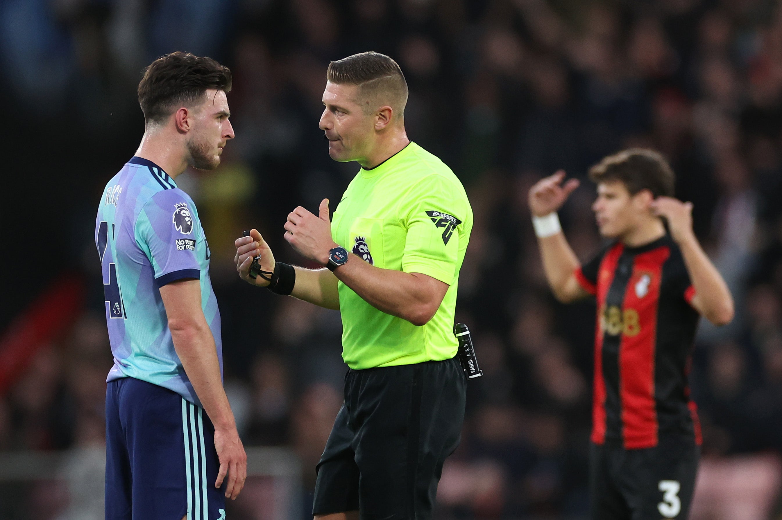 Rice speaks to referee Robert Jones during the defeat at Bournemouth